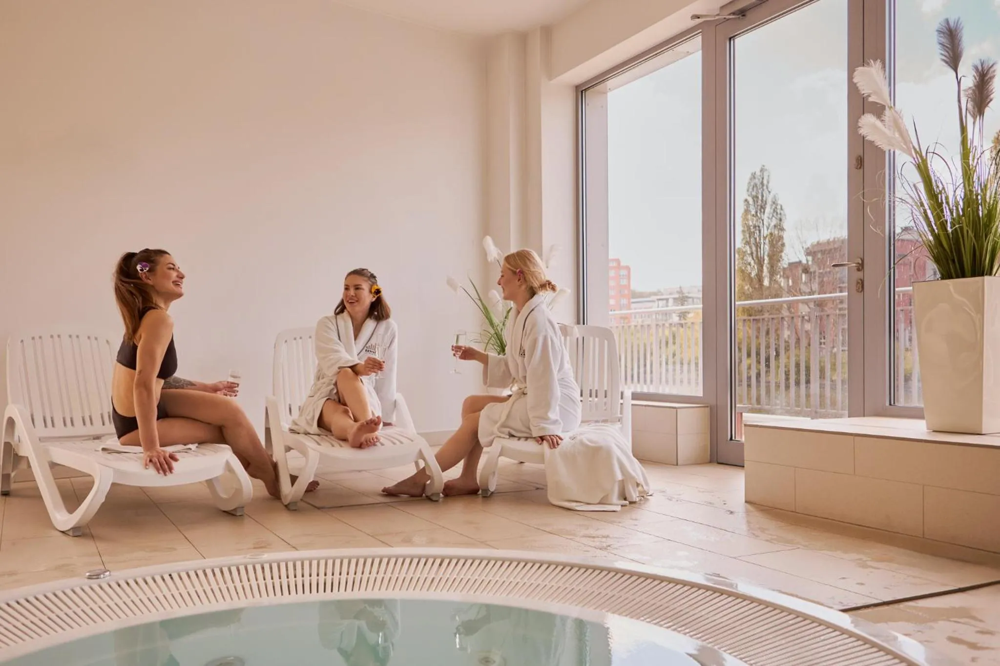 People in Waterlane Island - Riverview Pool, SPA, Gym & Parking by Downtown Apartments