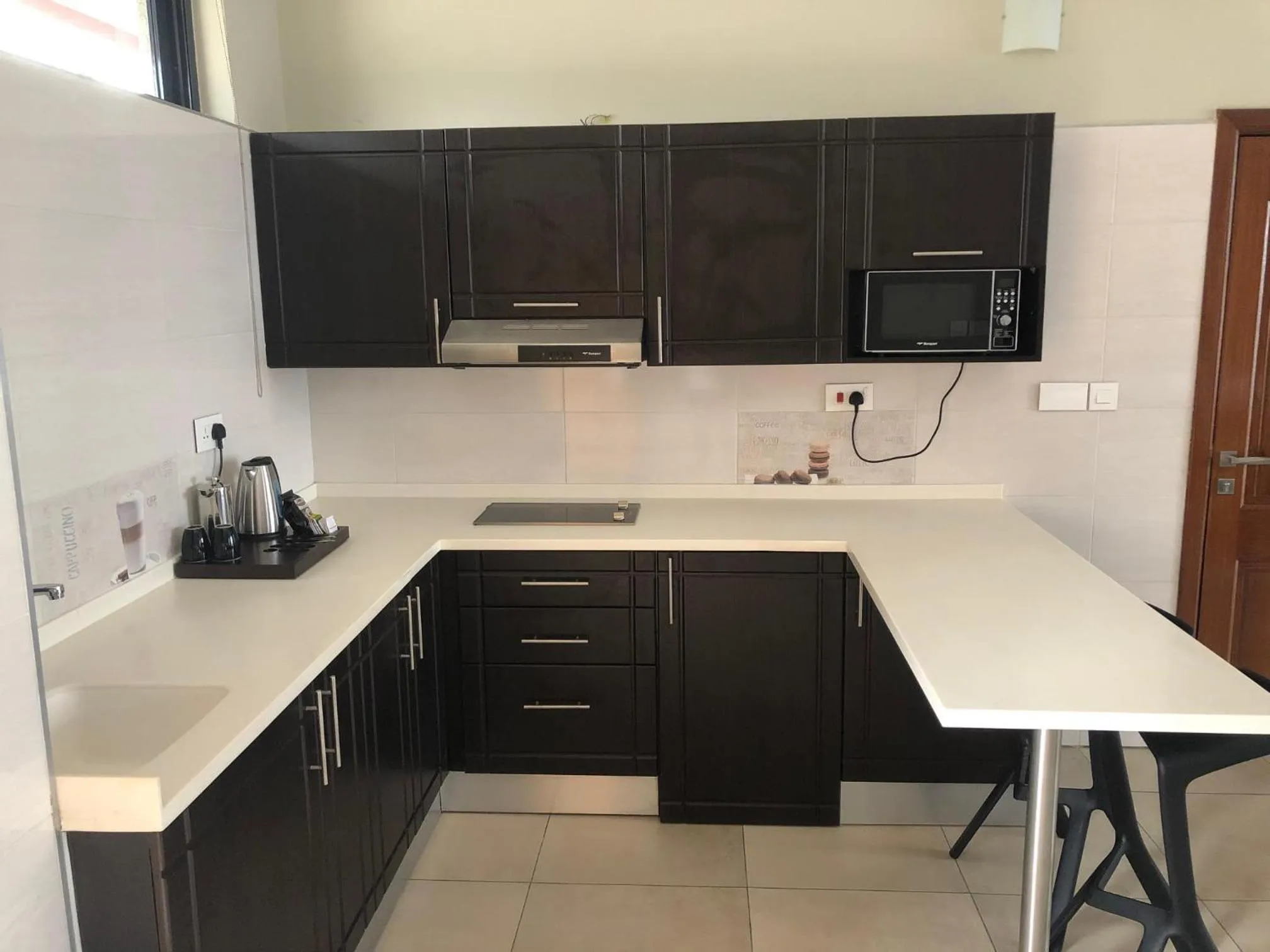 Kitchen or kitchenette in Mythos Boutique Hotel