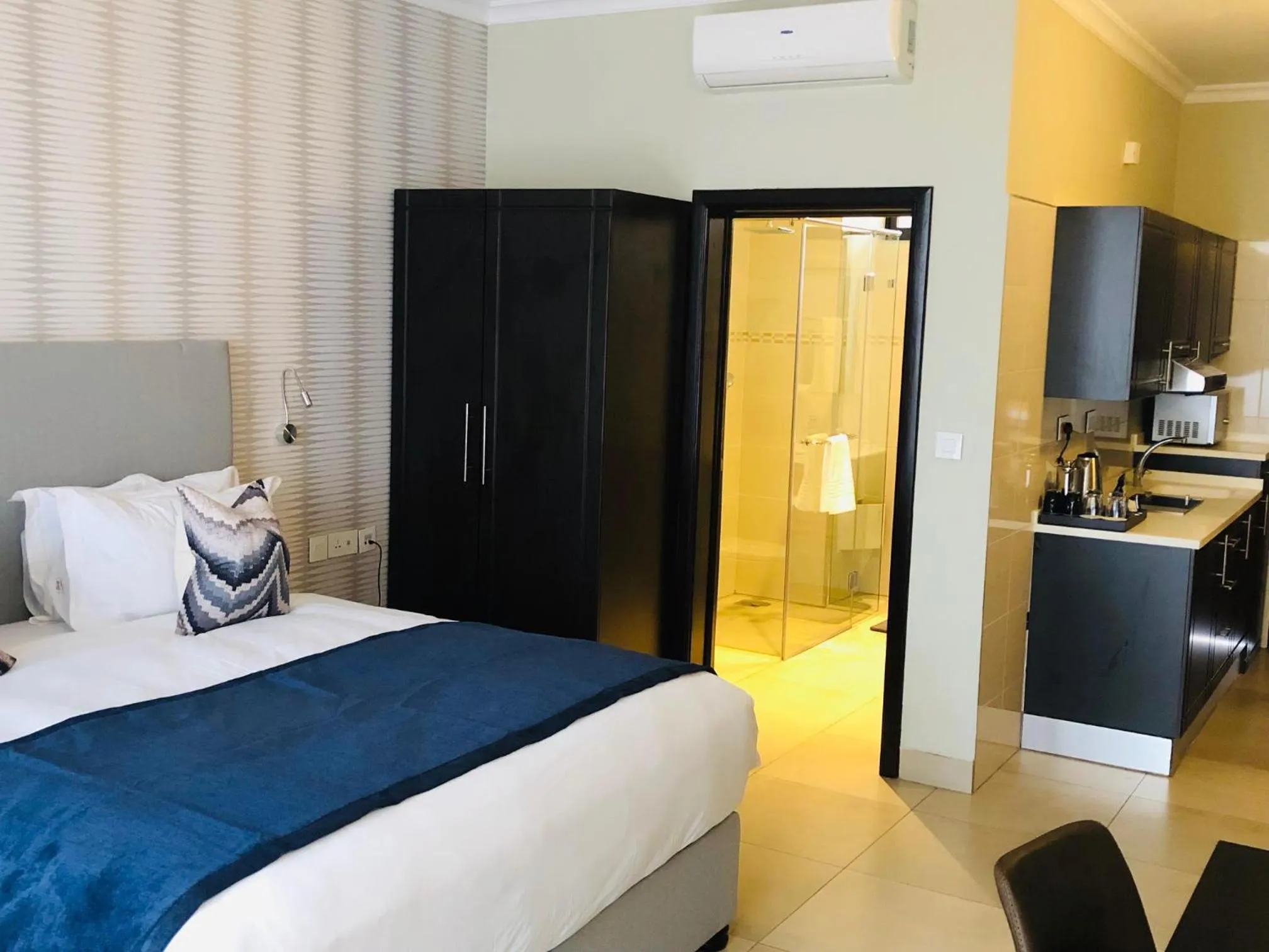 Bed in Mythos Boutique Hotel