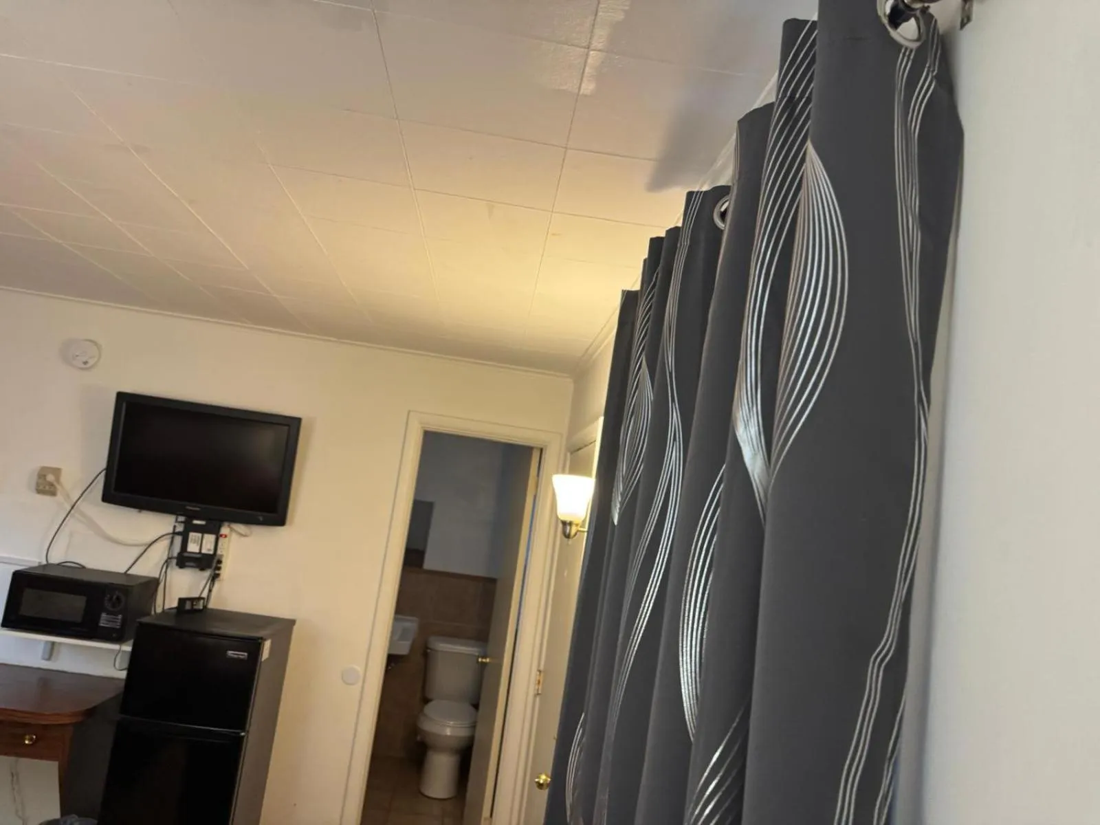 Bathroom in Economy Inn Cadillac MI by Hotel O