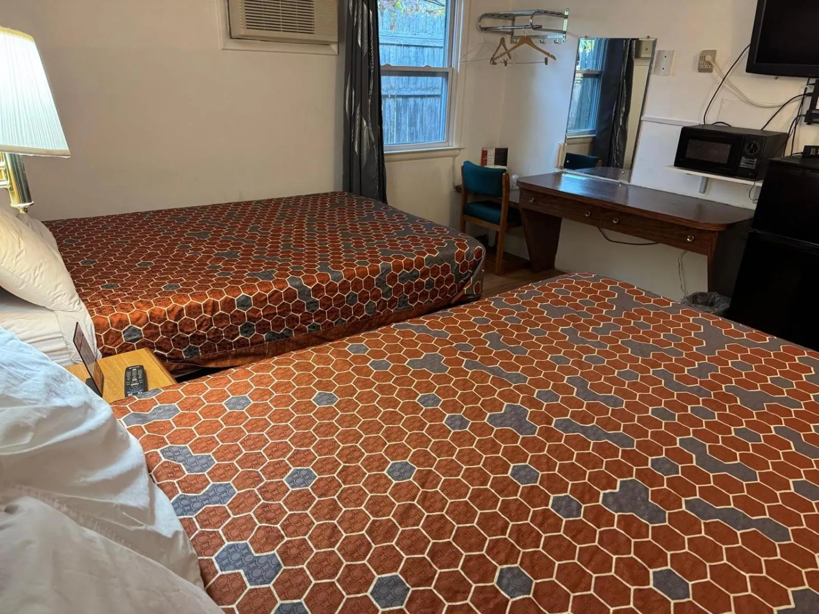 Bedroom, Bed in Economy Inn Cadillac MI by Hotel O