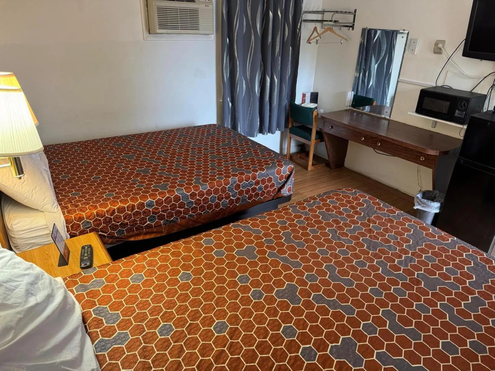 Bedroom, Bed in Economy Inn Cadillac MI by Hotel O