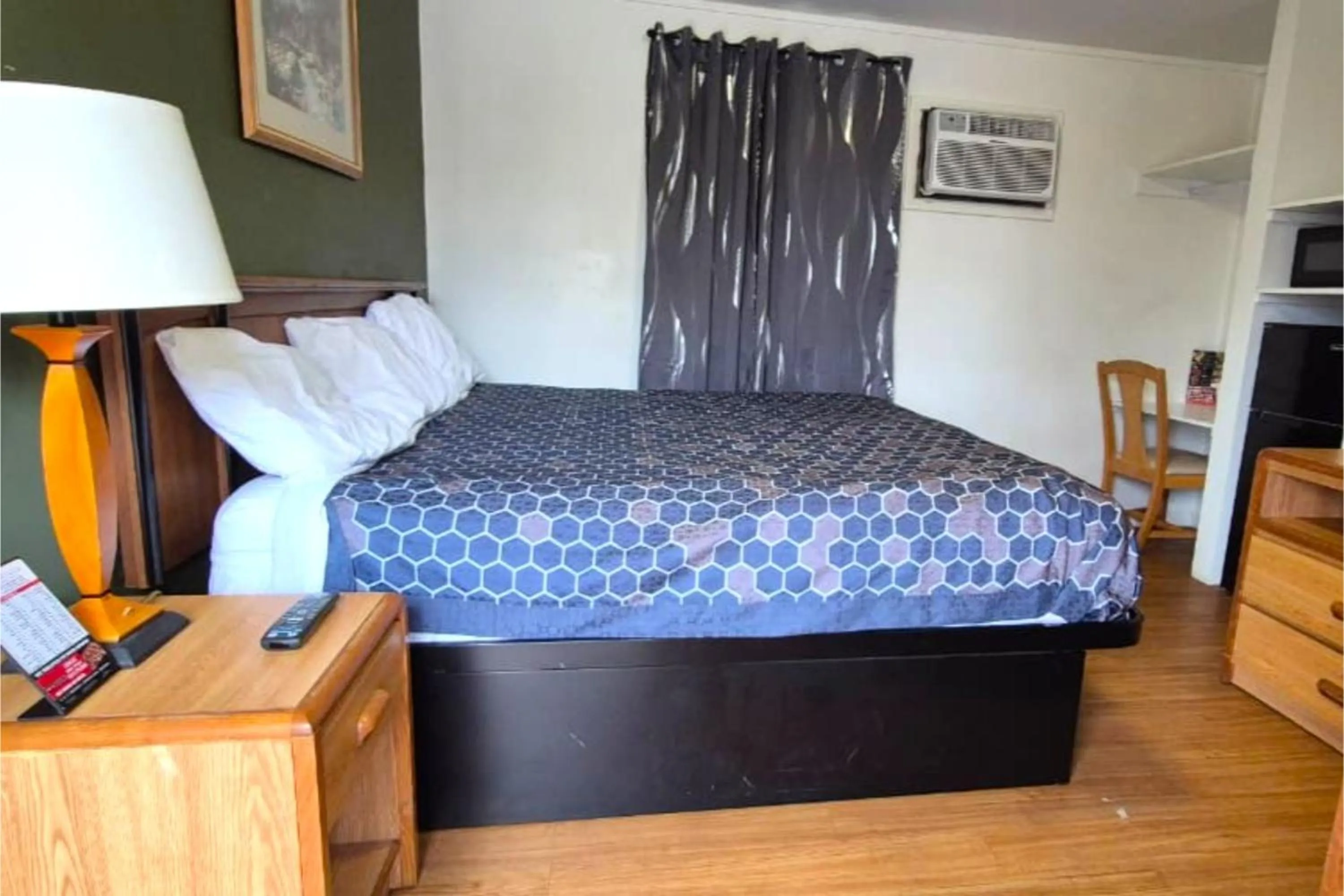 Bedroom, Bed in Economy Inn Cadillac MI by Hotel O