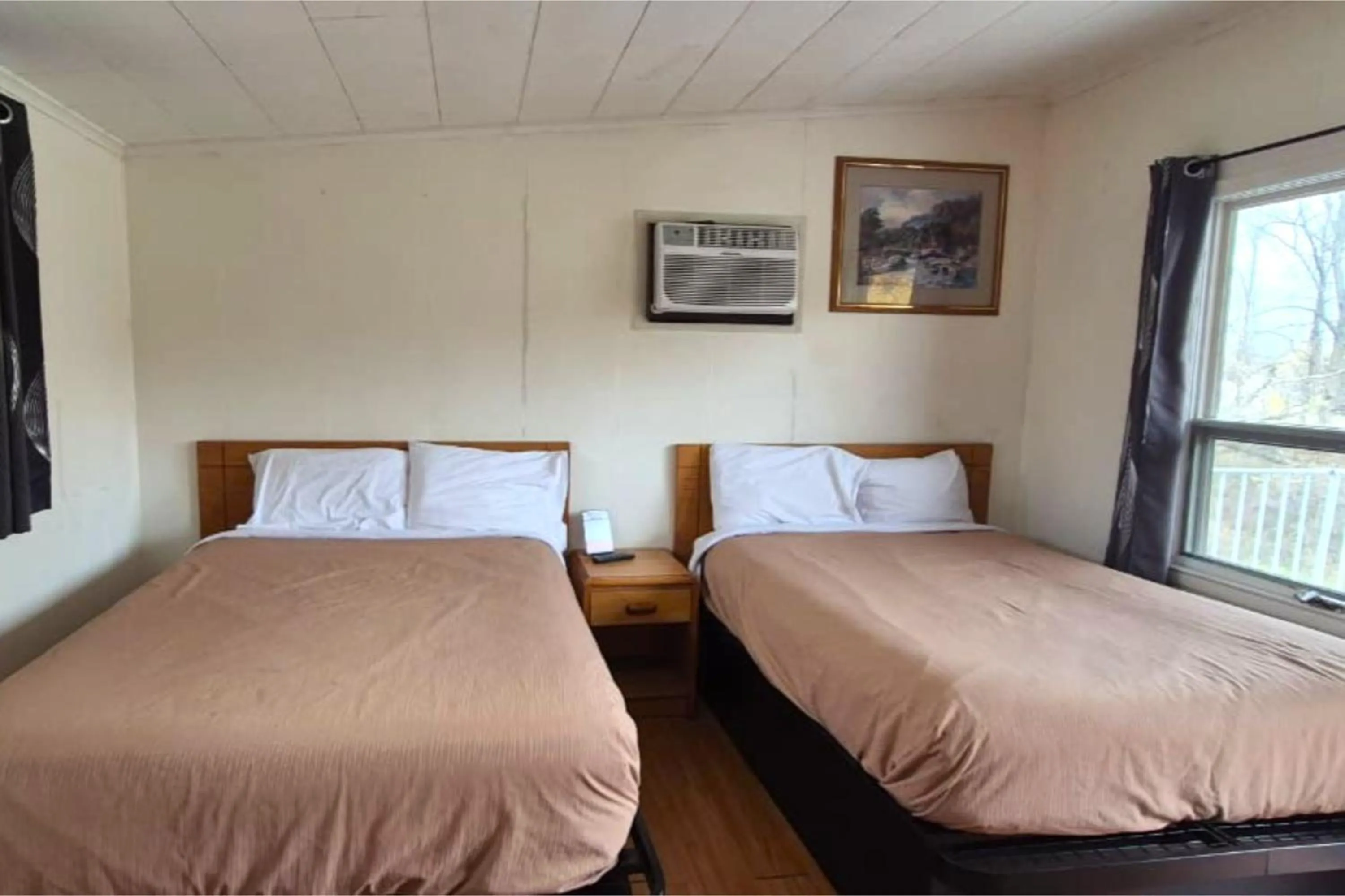 Bedroom, Bed in Economy Inn Cadillac MI by Hotel O