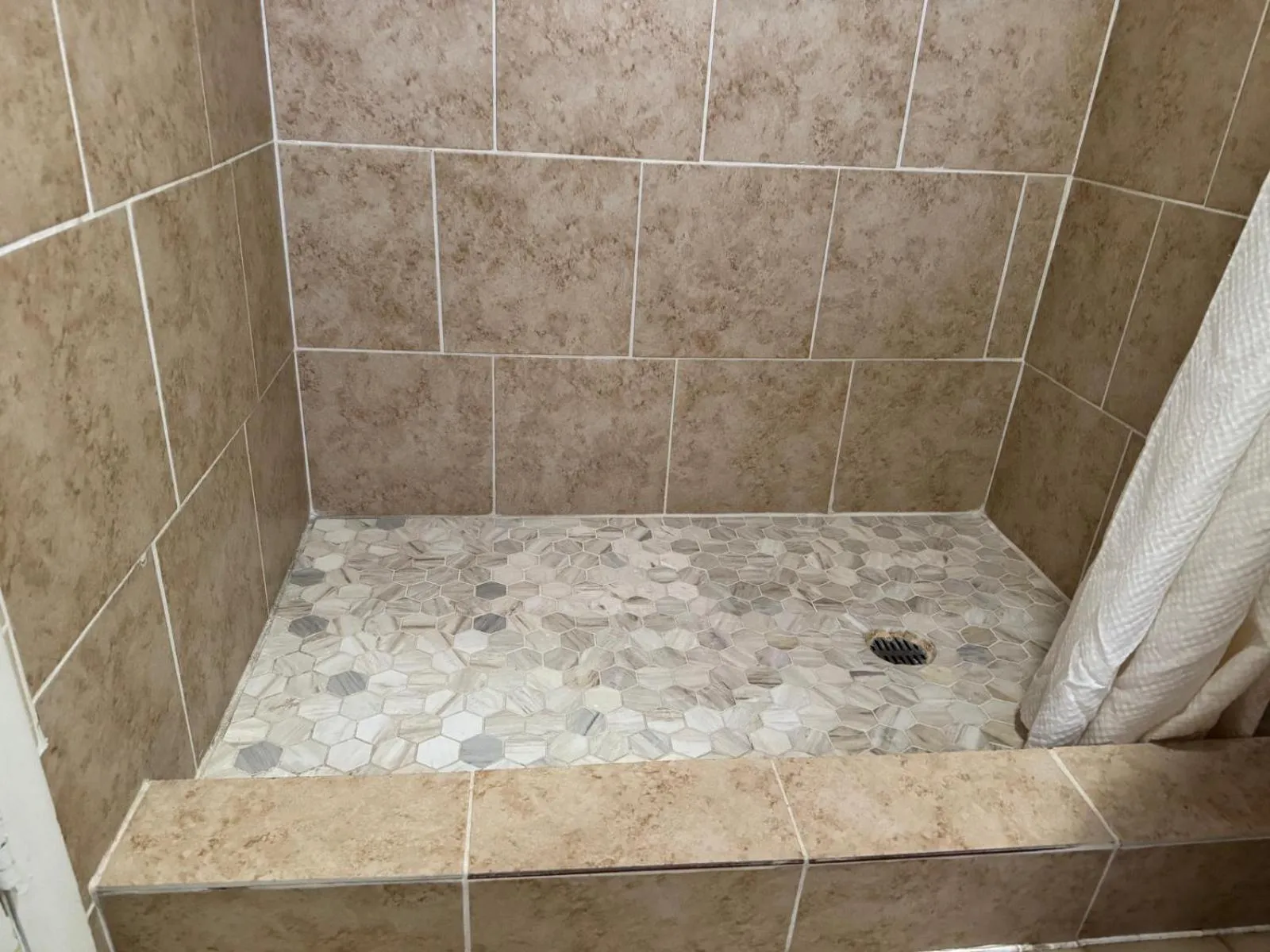 Bathroom in Economy Inn Cadillac MI by Hotel O