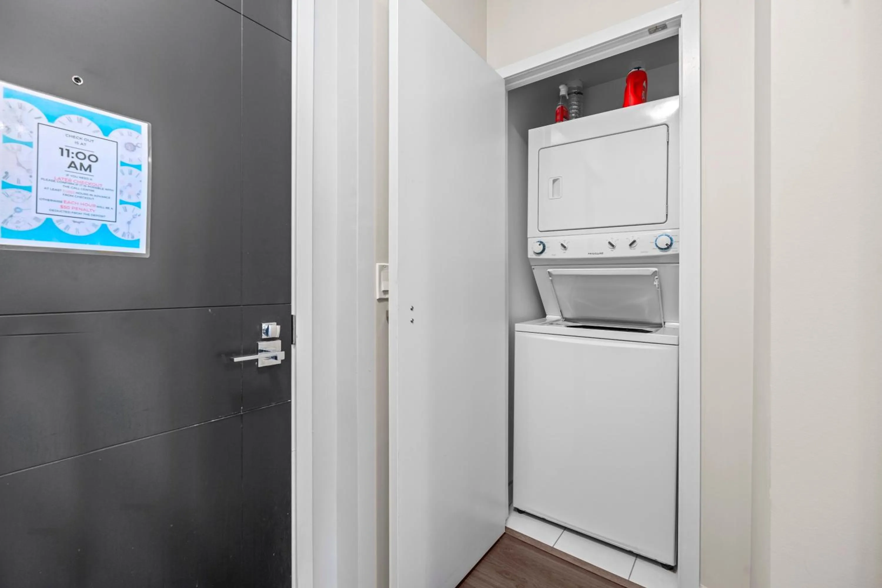 washing machine in Modern Lillian St Apartments by GLOBALSTAY