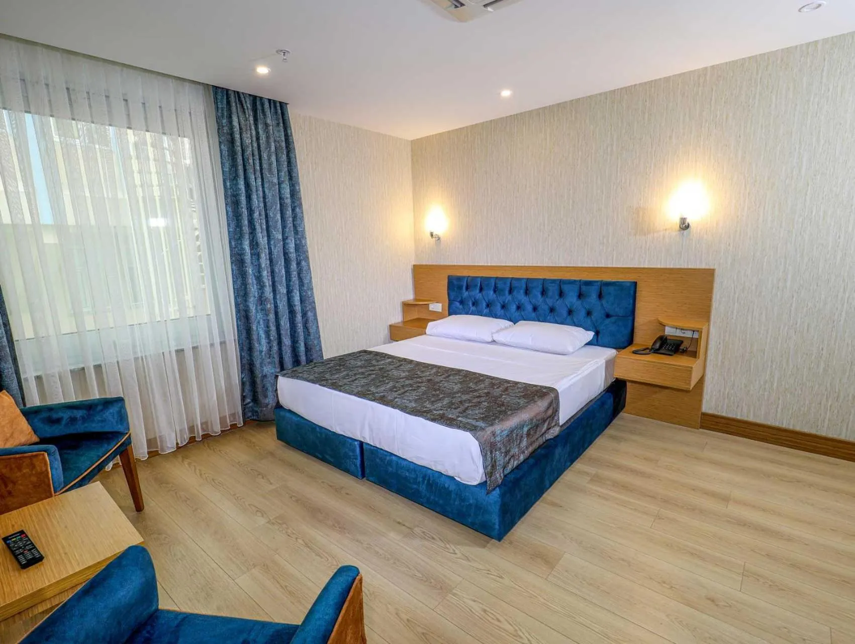 Bed in Grand Elmira Suites