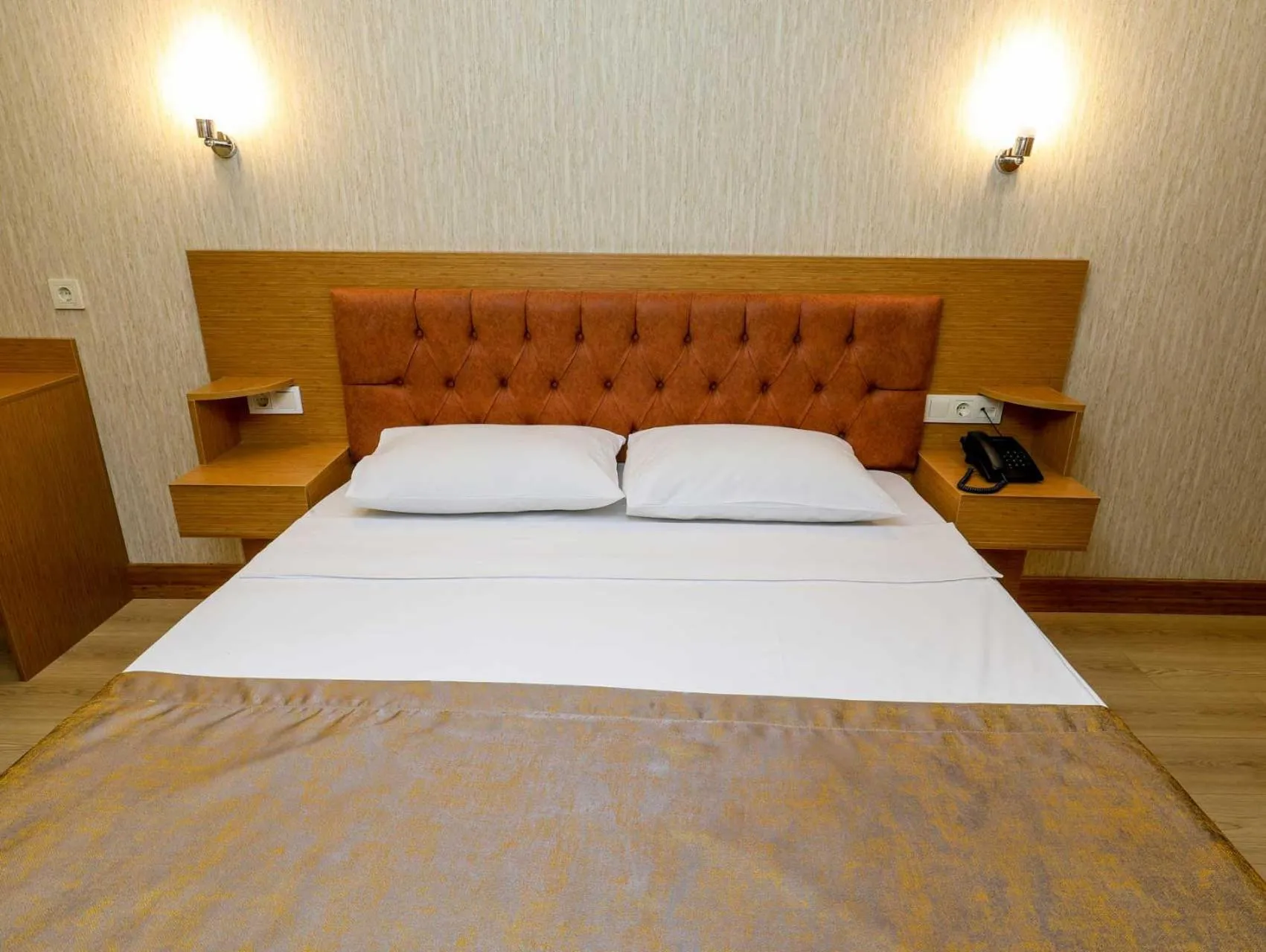 Bed in Grand Elmira Suites