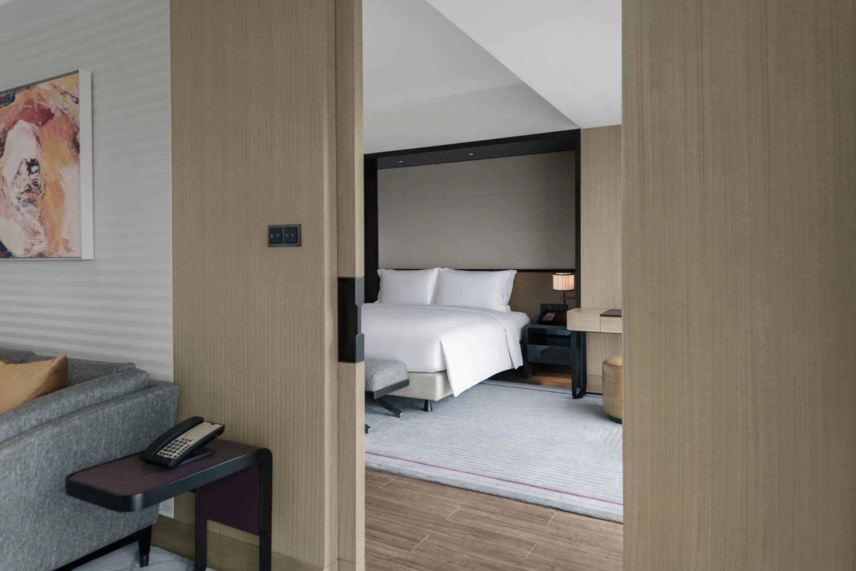 Bed in New World Langfang Hotel