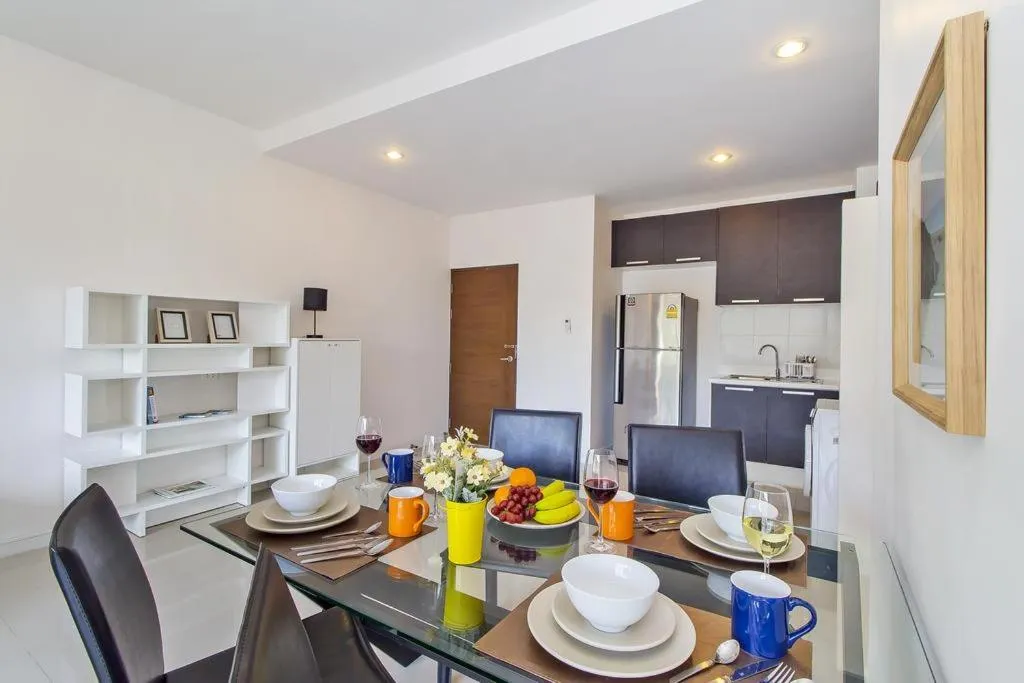 Dining area in Chic Condo by RESAVA