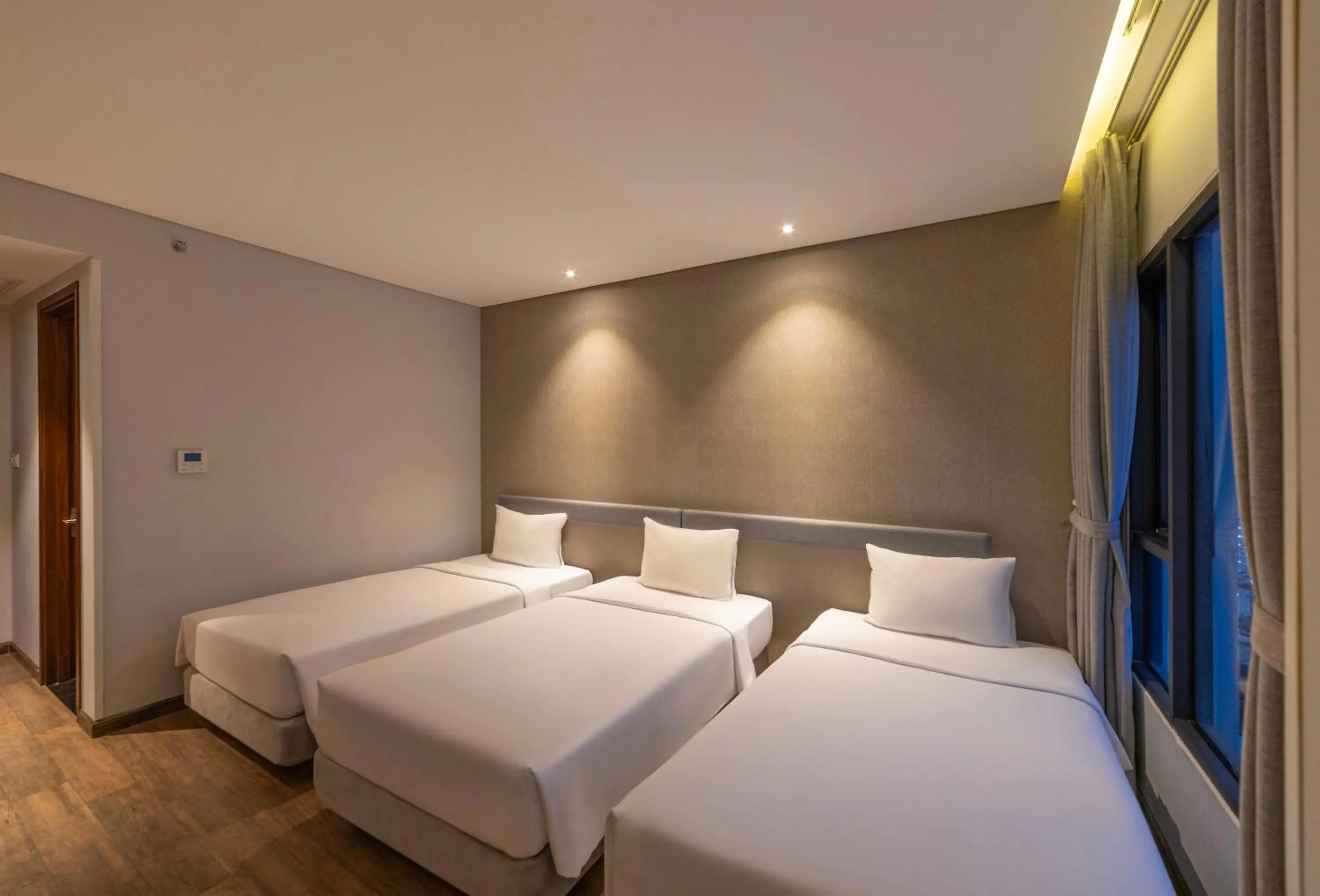 Bed in Em Oi Boutique Hotel