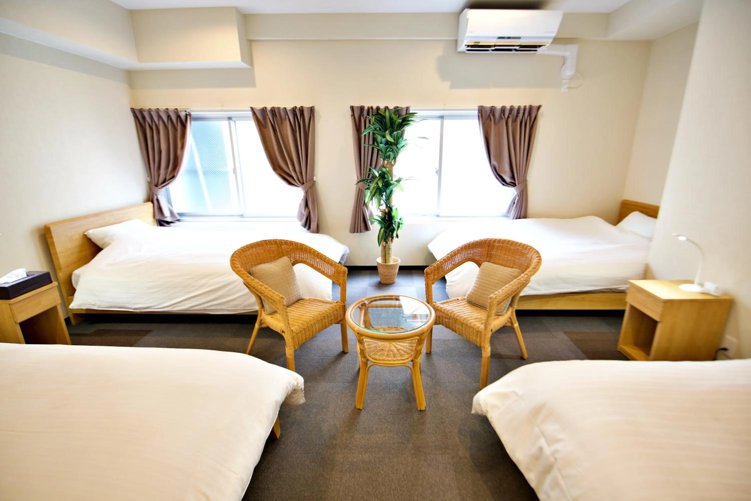 Bed in KURA HOTEL IZUMISANO