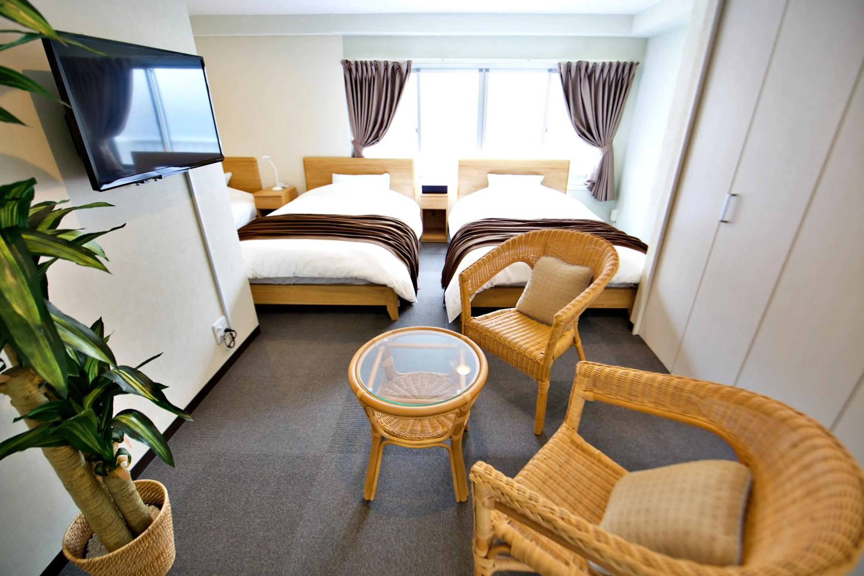 Bed in KURA HOTEL IZUMISANO