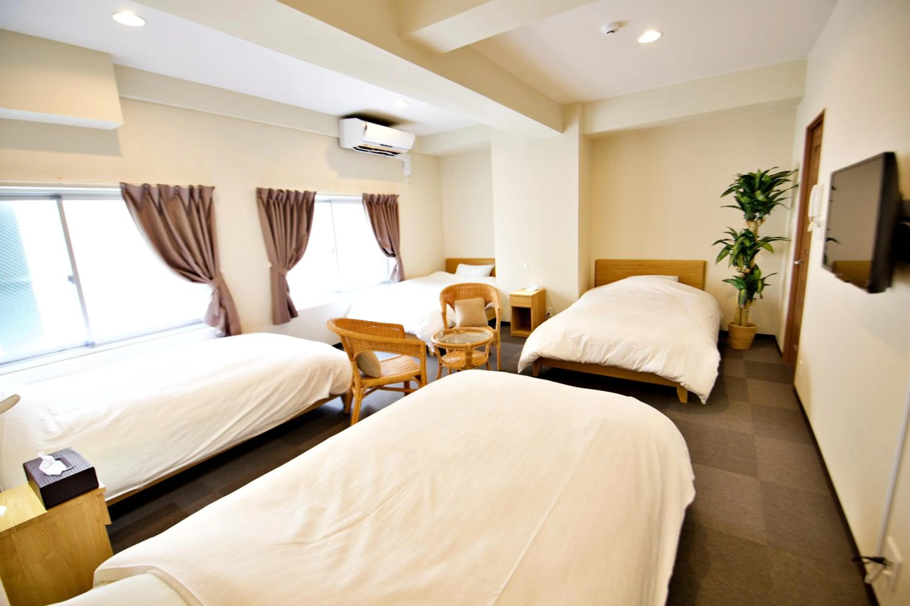 Bed in KURA HOTEL IZUMISANO