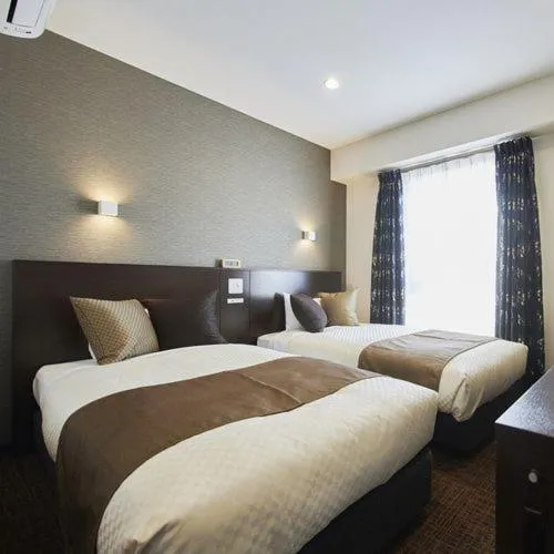 Bed in The Celecton Omiya Kaisoku Kitamoto Ekimae