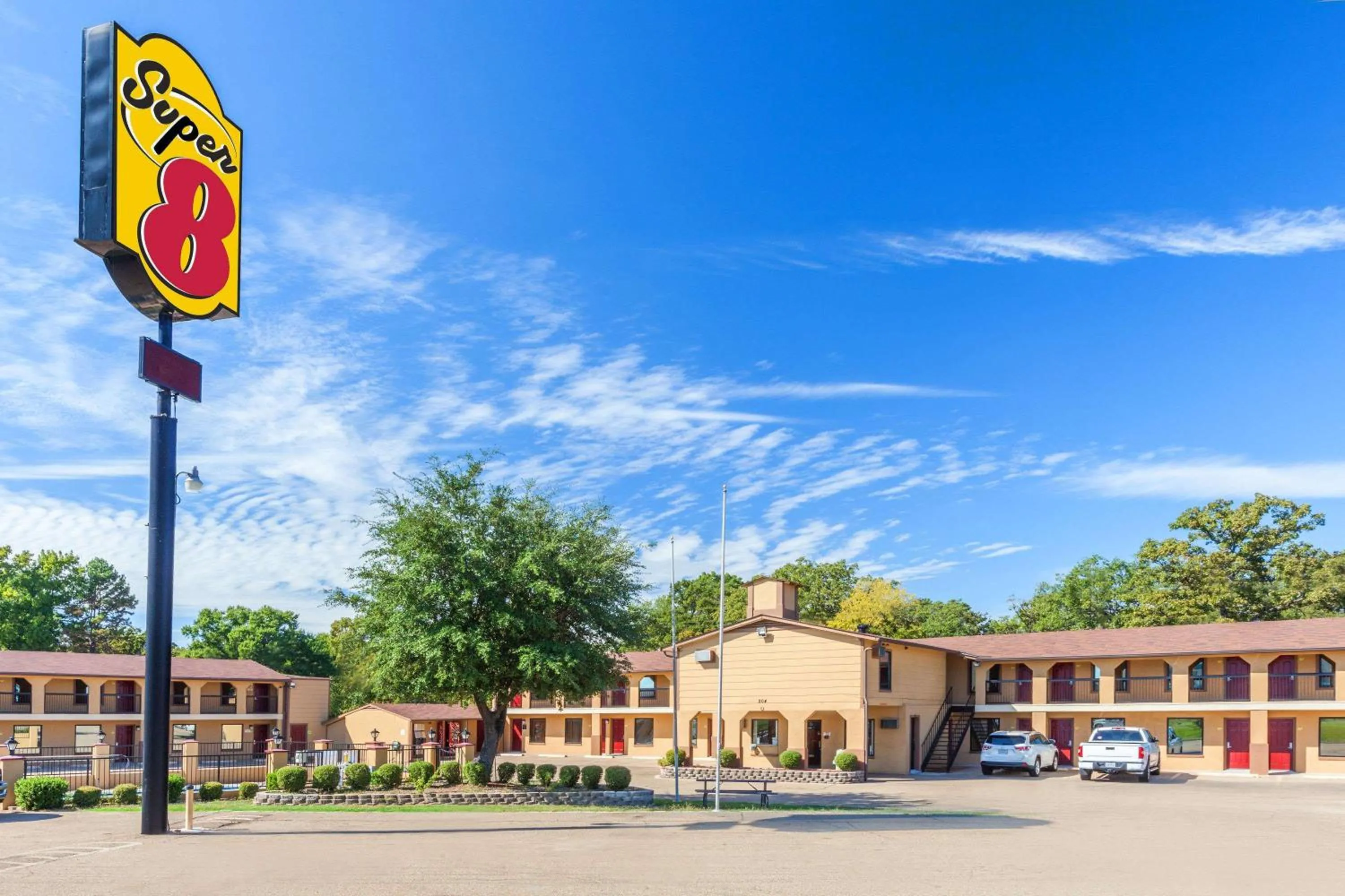 Property building in Super 8 by Wyndham Mt. Pleasant TX