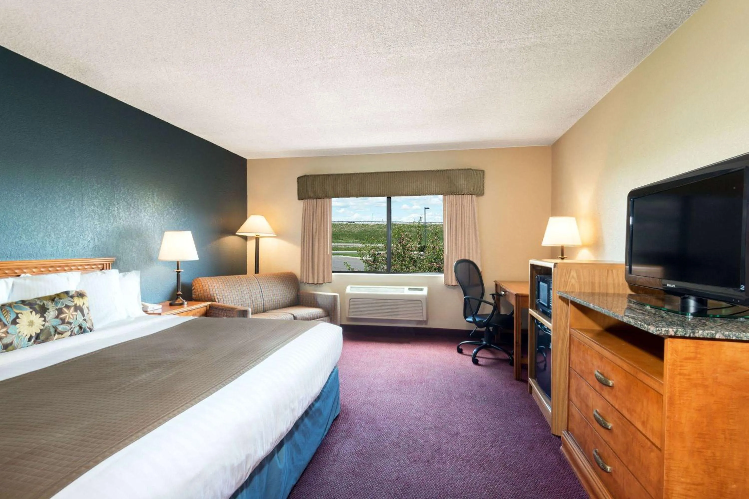 Photo of the whole room, Bed in AmericInn by Wyndham Rexburg BYUI