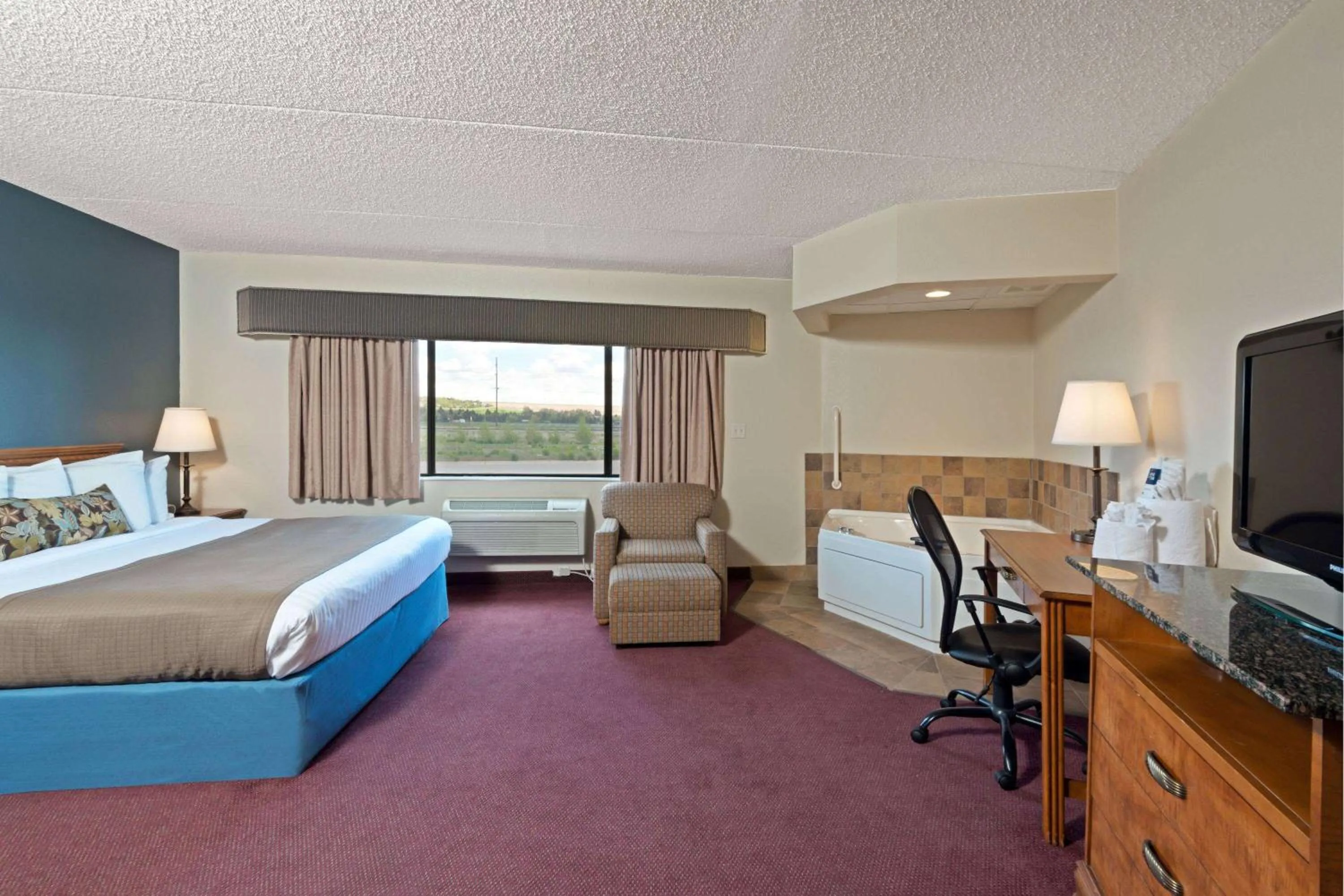 Photo of the whole room, Bed in AmericInn by Wyndham Rexburg BYUI