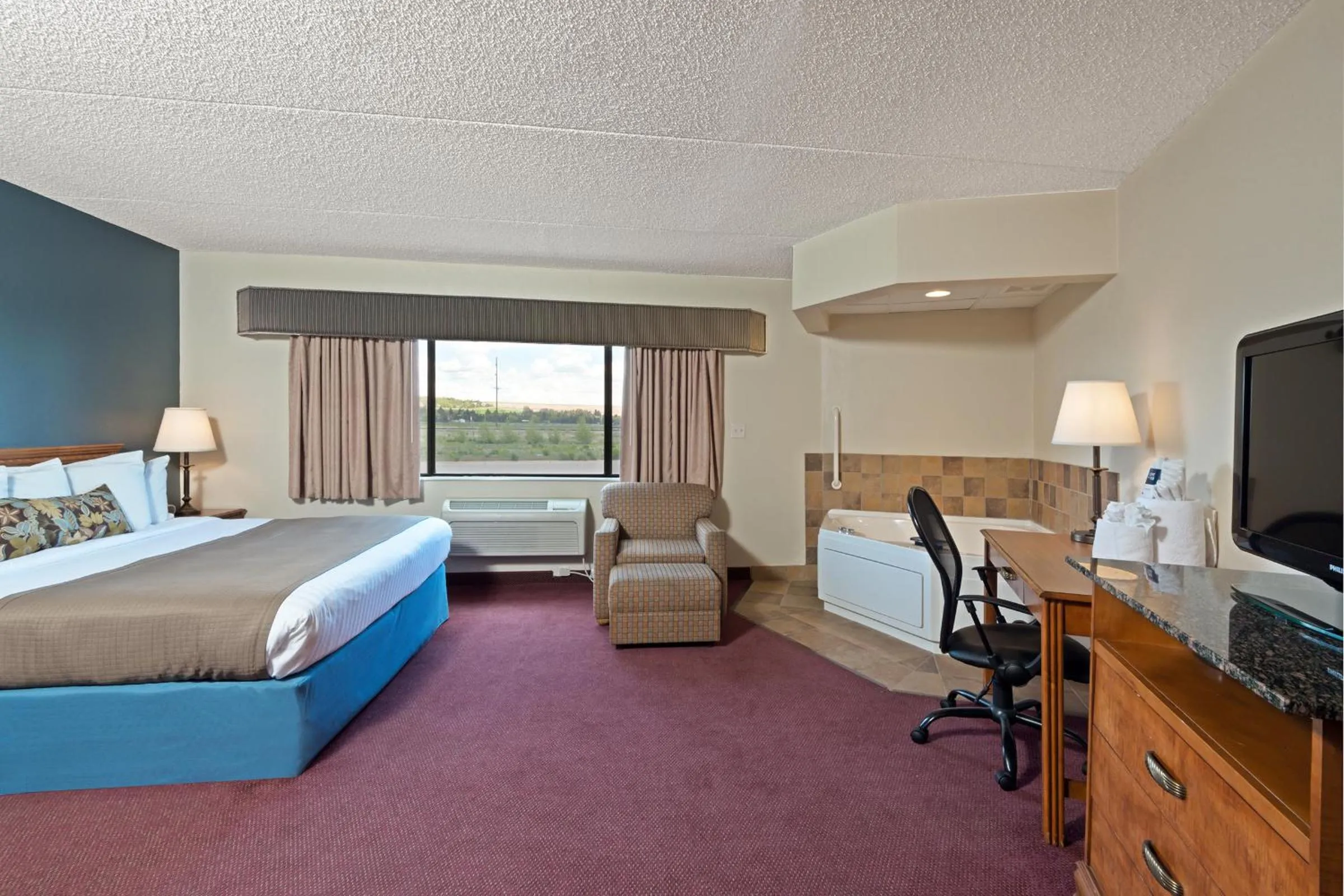 Photo of the whole room, Bed in AmericInn by Wyndham Rexburg BYUI