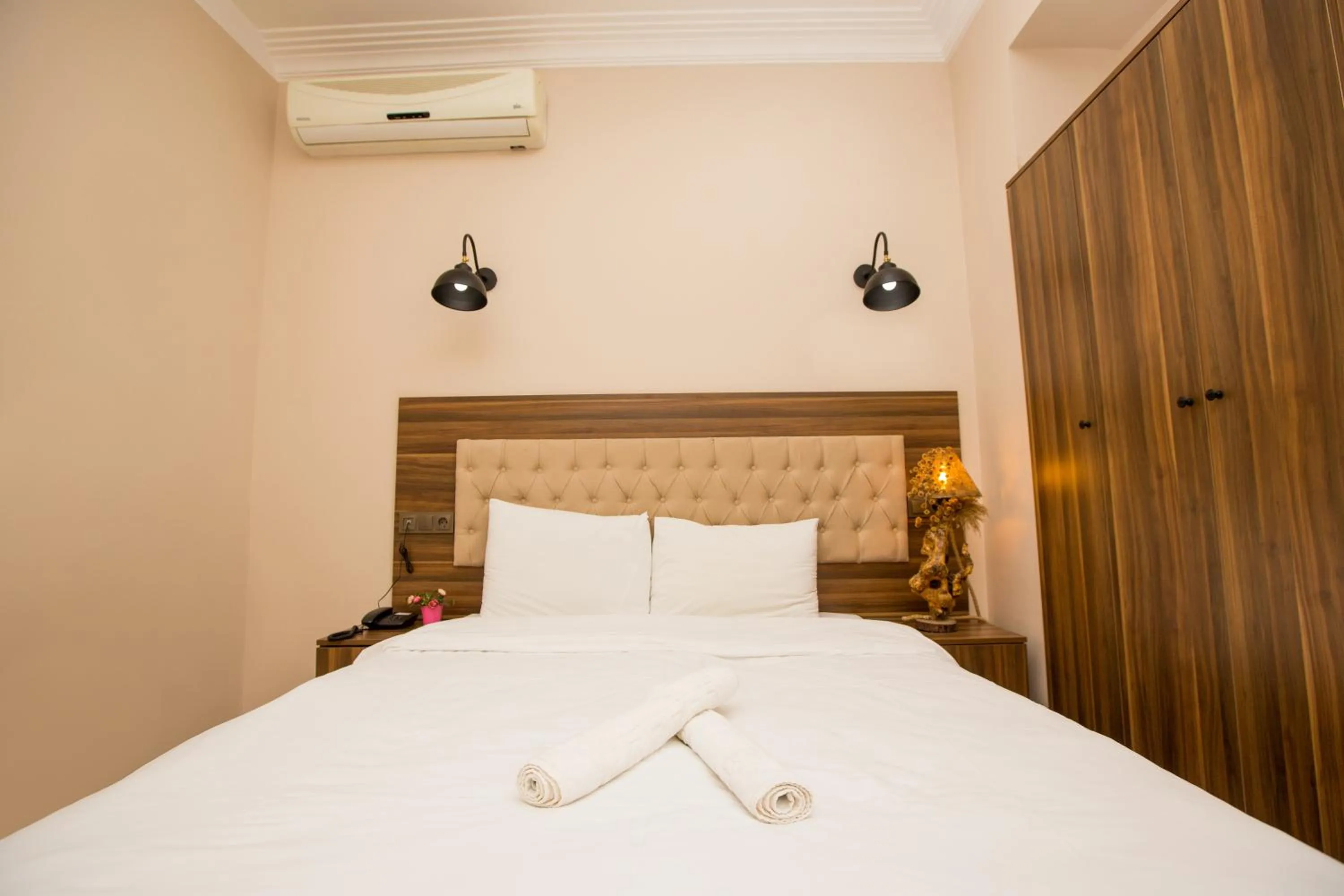 Bed in Corner Garden Hotel