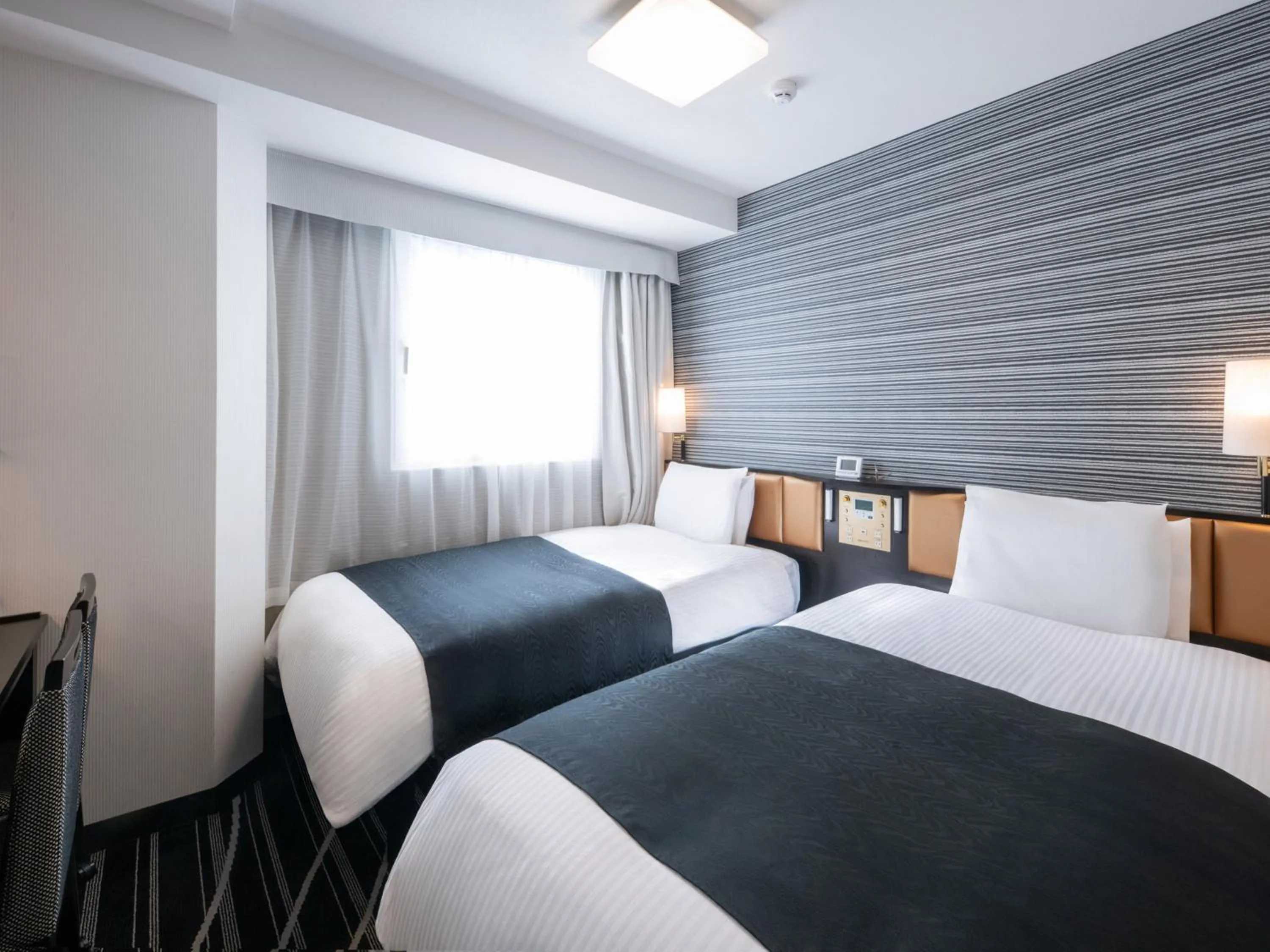 Bed in APA Hotel Yamanote Otsuka Ekimae Tower