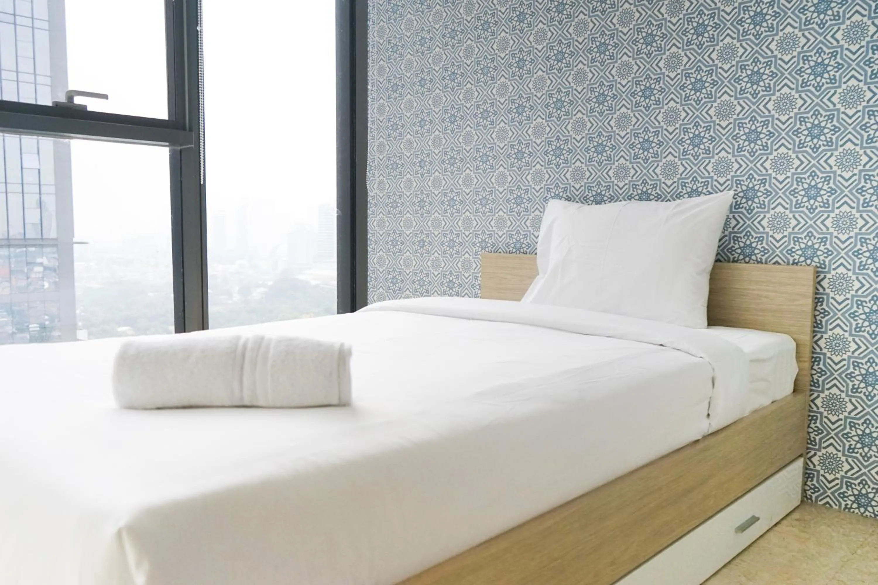 Bedroom, Bed in South Tower 2BR at L'Avenue Apartment By Travelio