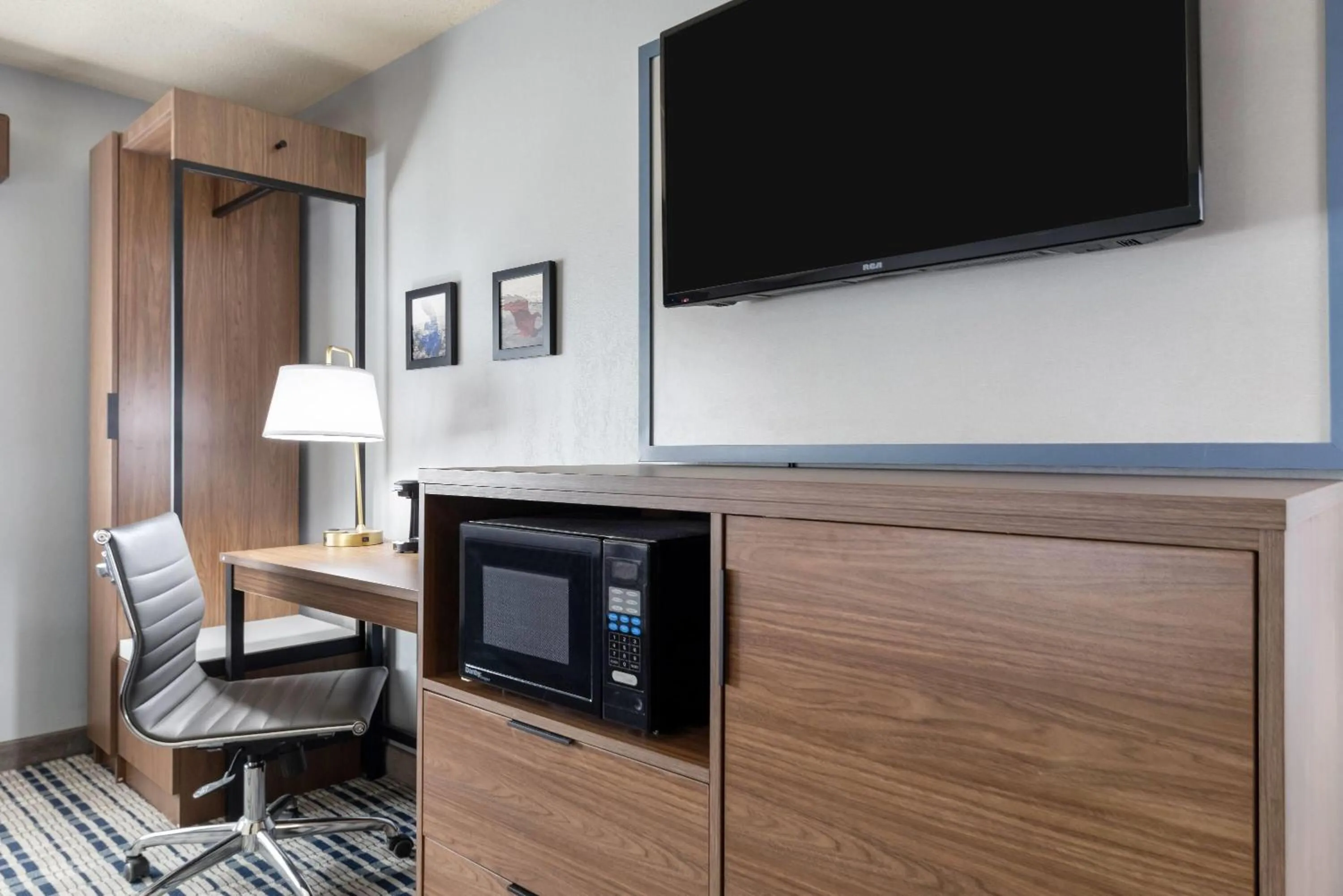 Bed in AmericInn by Wyndham Chamberlain Conference Center