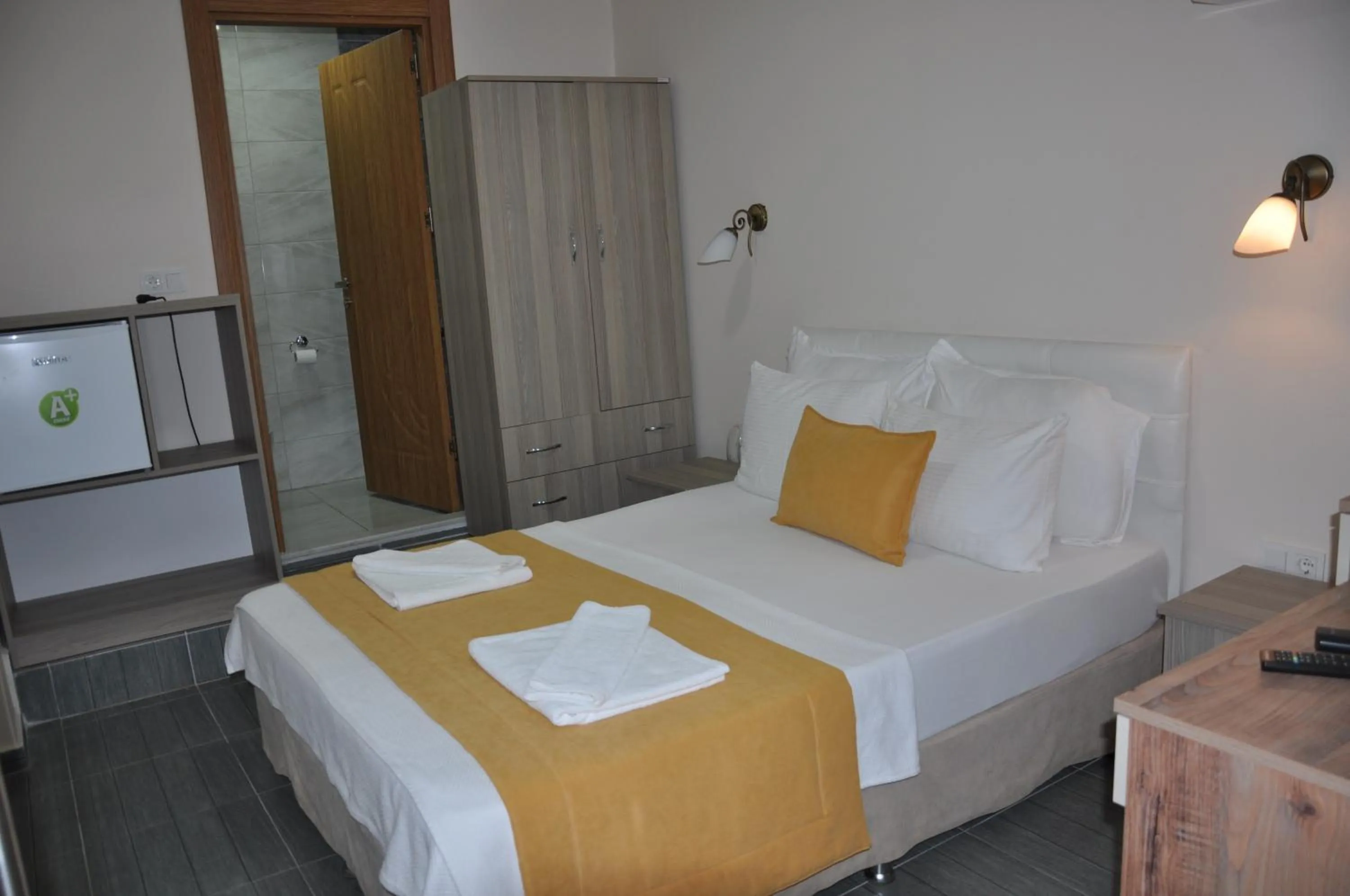 Bed in Neoss Boutique Hotel