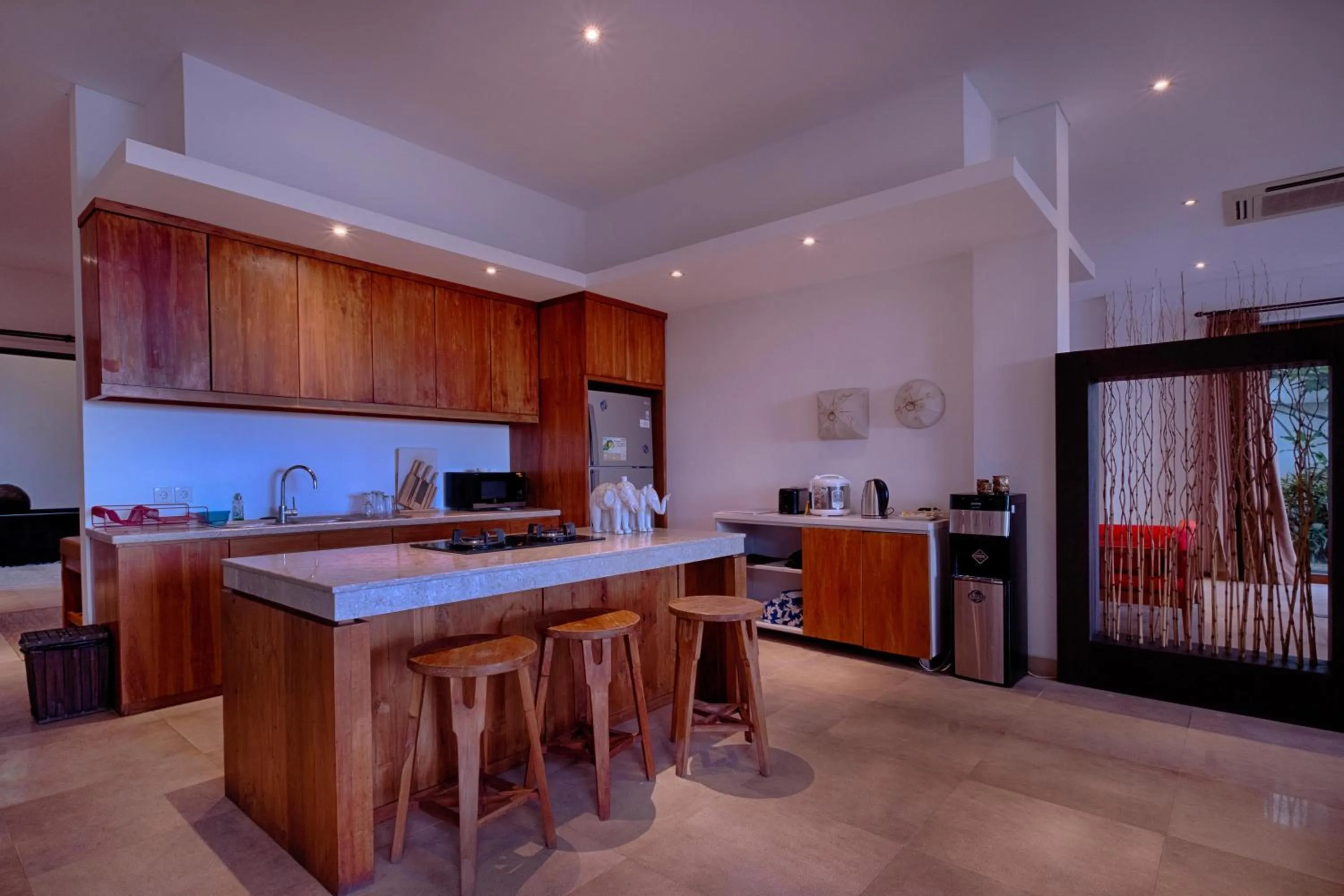 Kitchen or kitchenette in Keramas Beachfront Villa by Sanga Sanga Hospitality