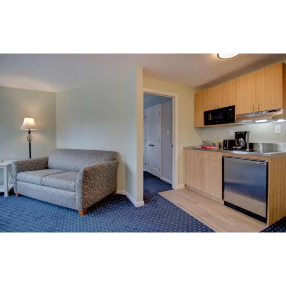 Kitchen or kitchenette, Bed in Seacastles Resort