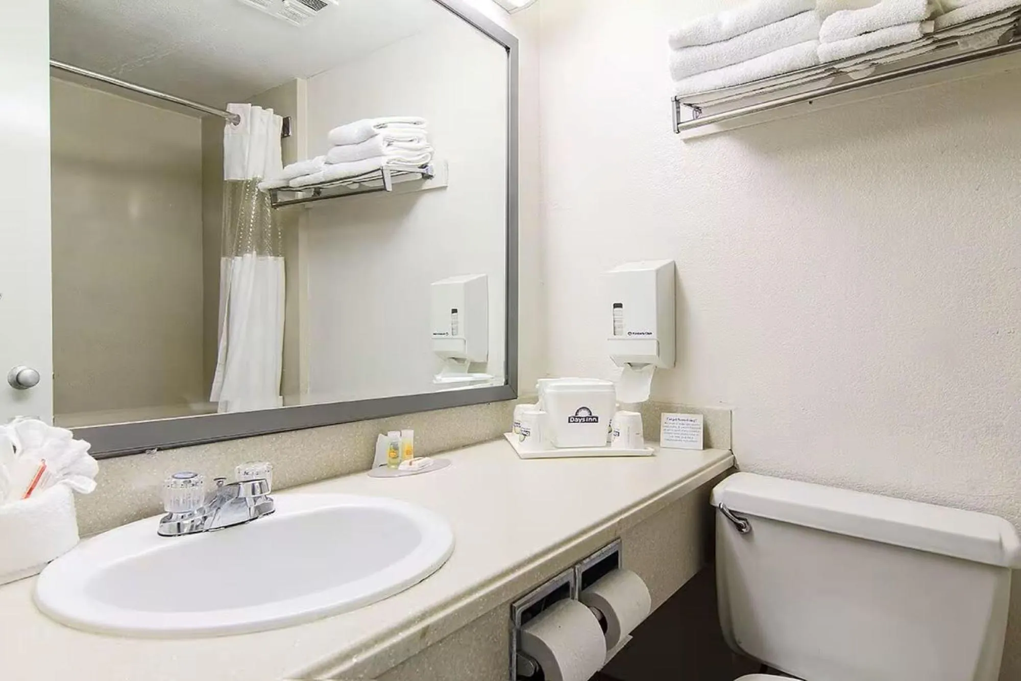 Bathroom in Days Inn by Wyndham Market Center Dallas Love Field