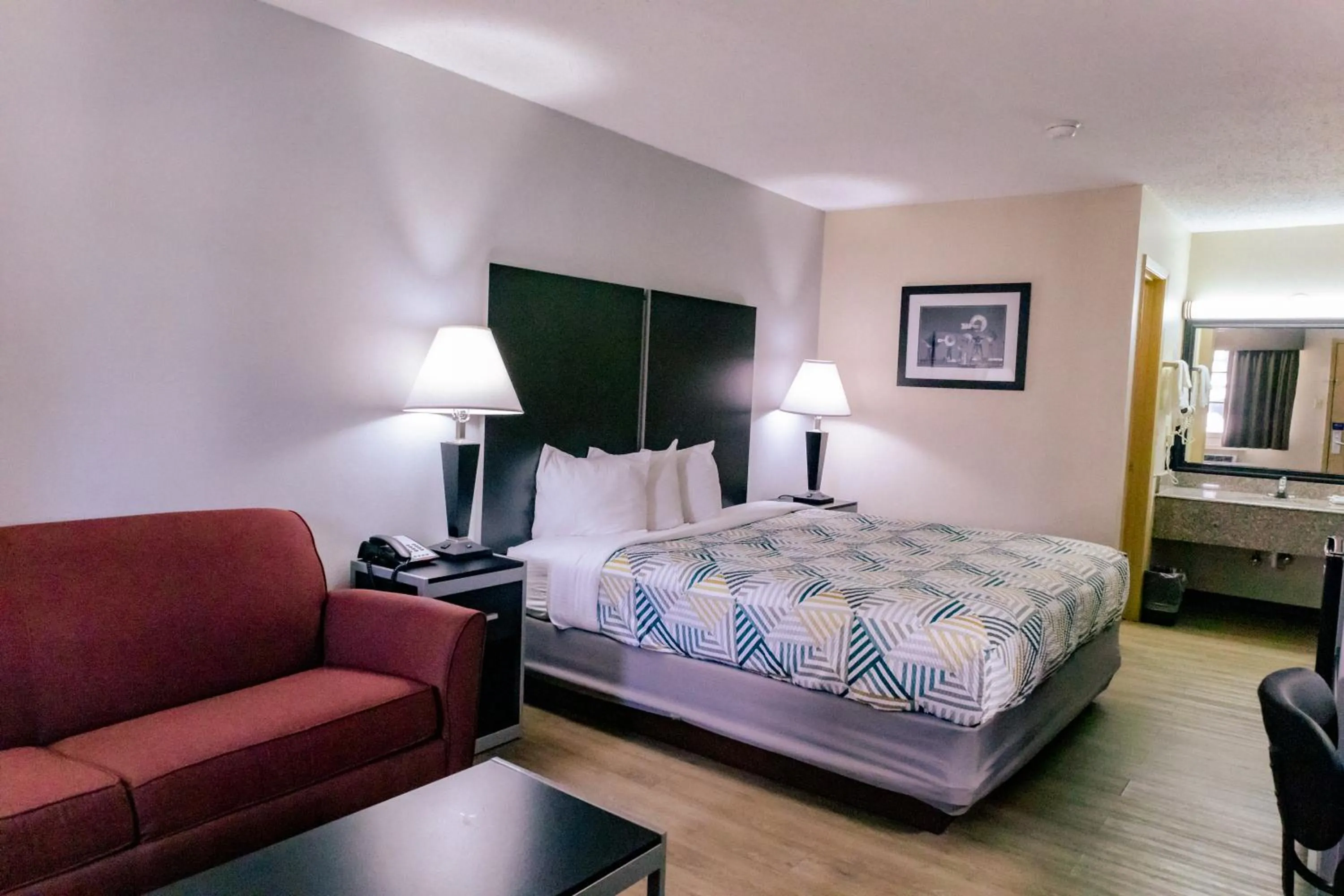 Seating area, Bed in Motel 6 Nacogdoches, TX