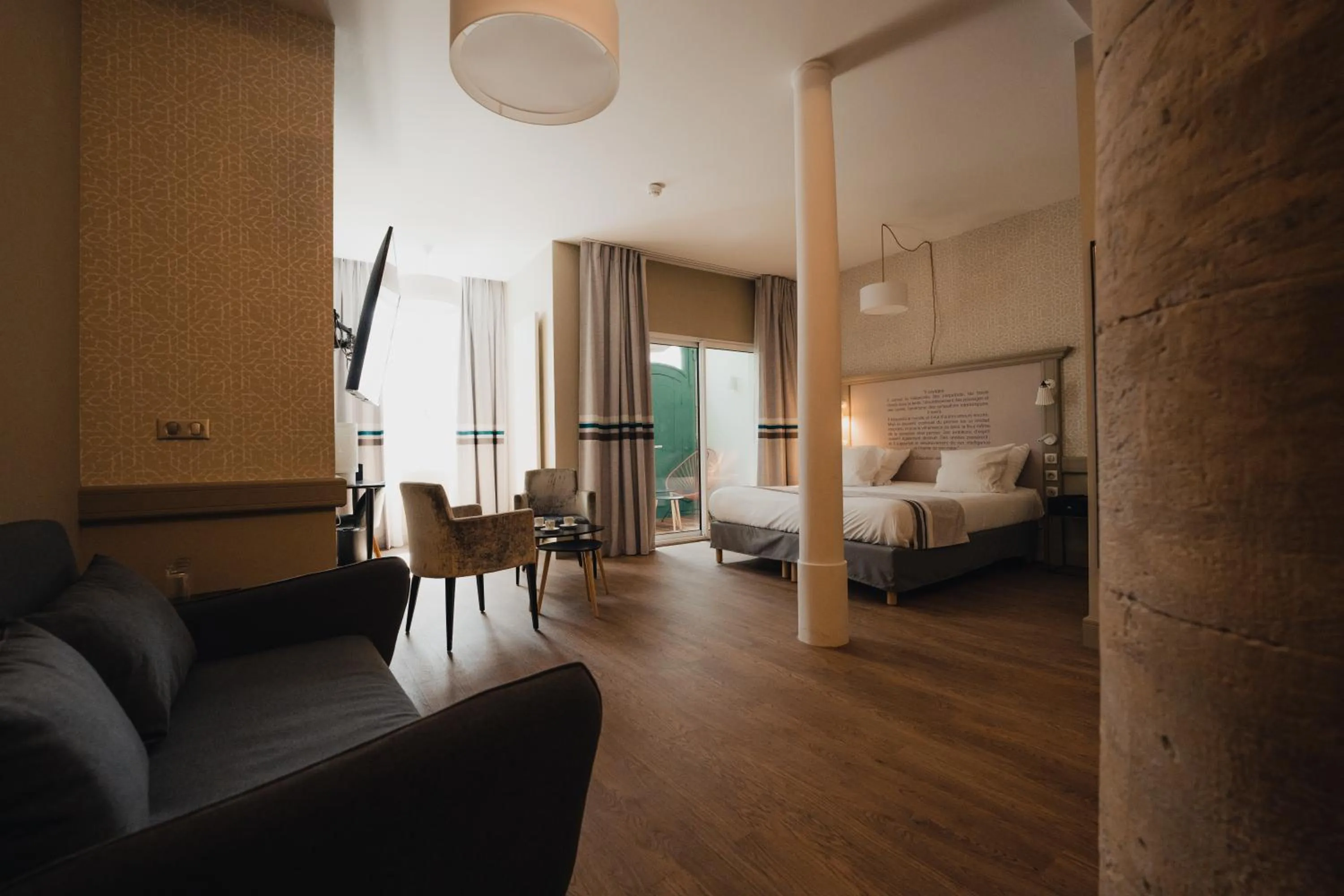 Living room, Bed in Hôtel Littéraire Gustave Flaubert, BW Signature Collection