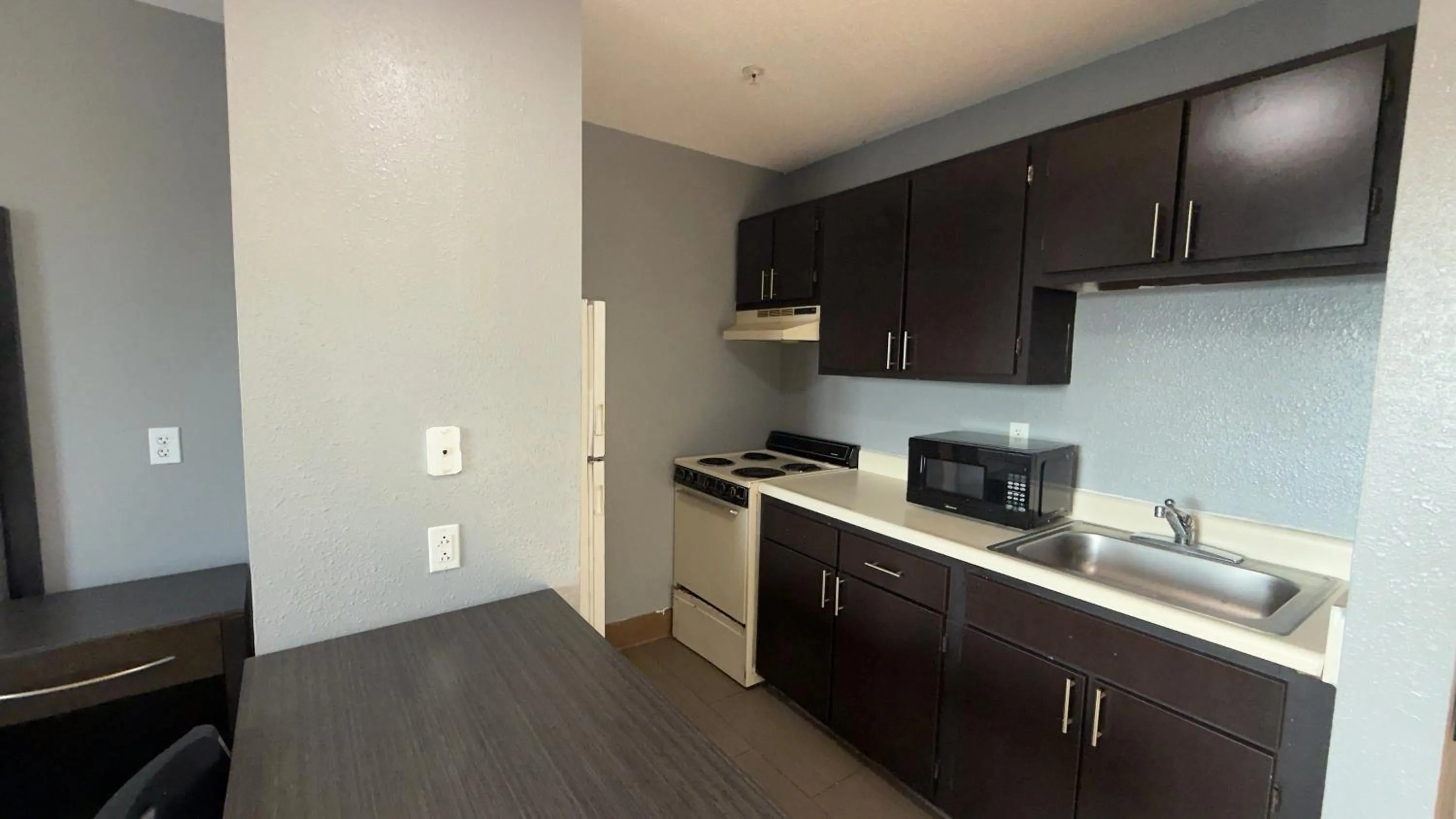 Kitchen or kitchenette in Welcome Suites Hazelwood Extended Stay Hotel