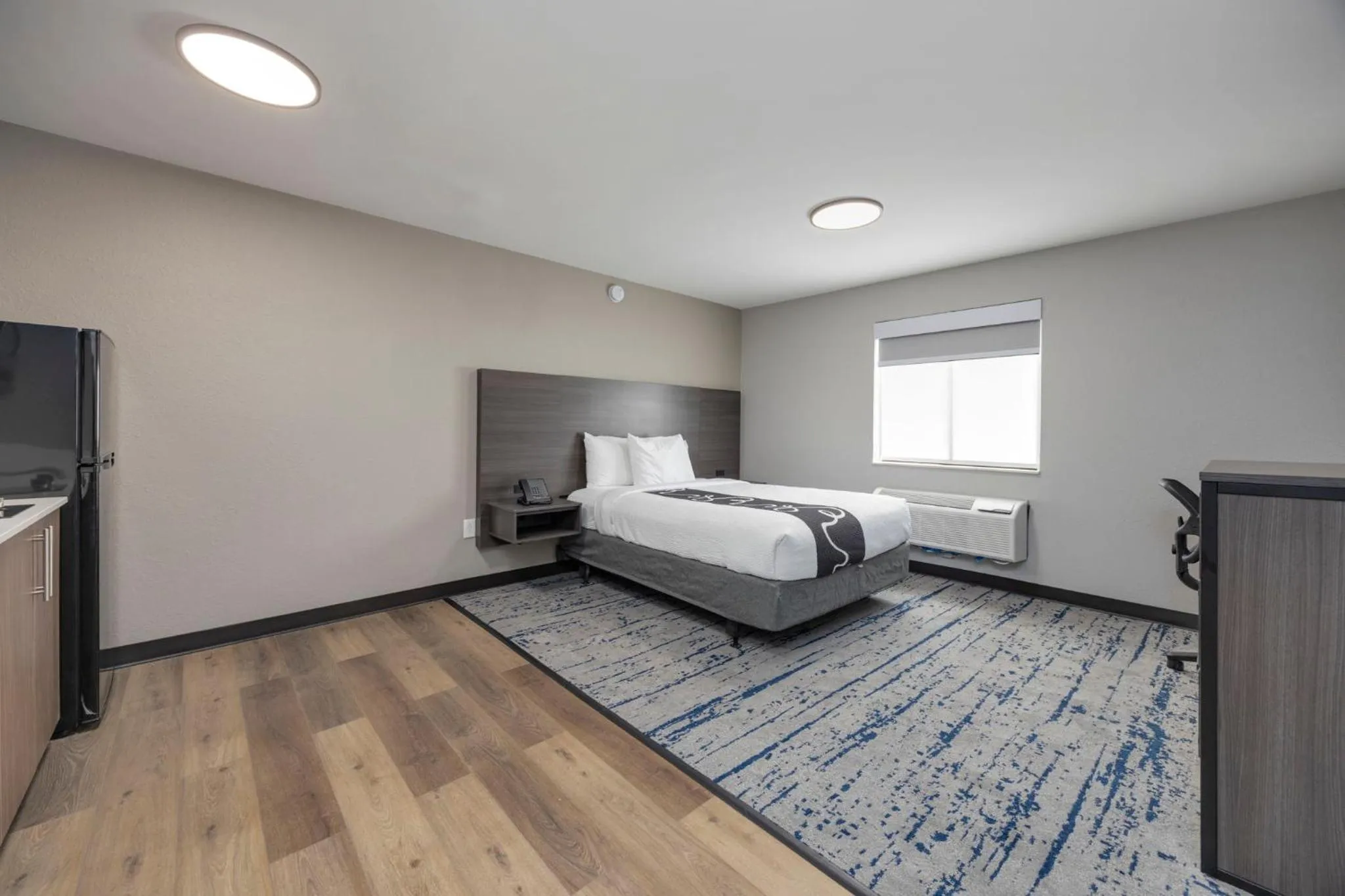 Bed in HomeStay Suites