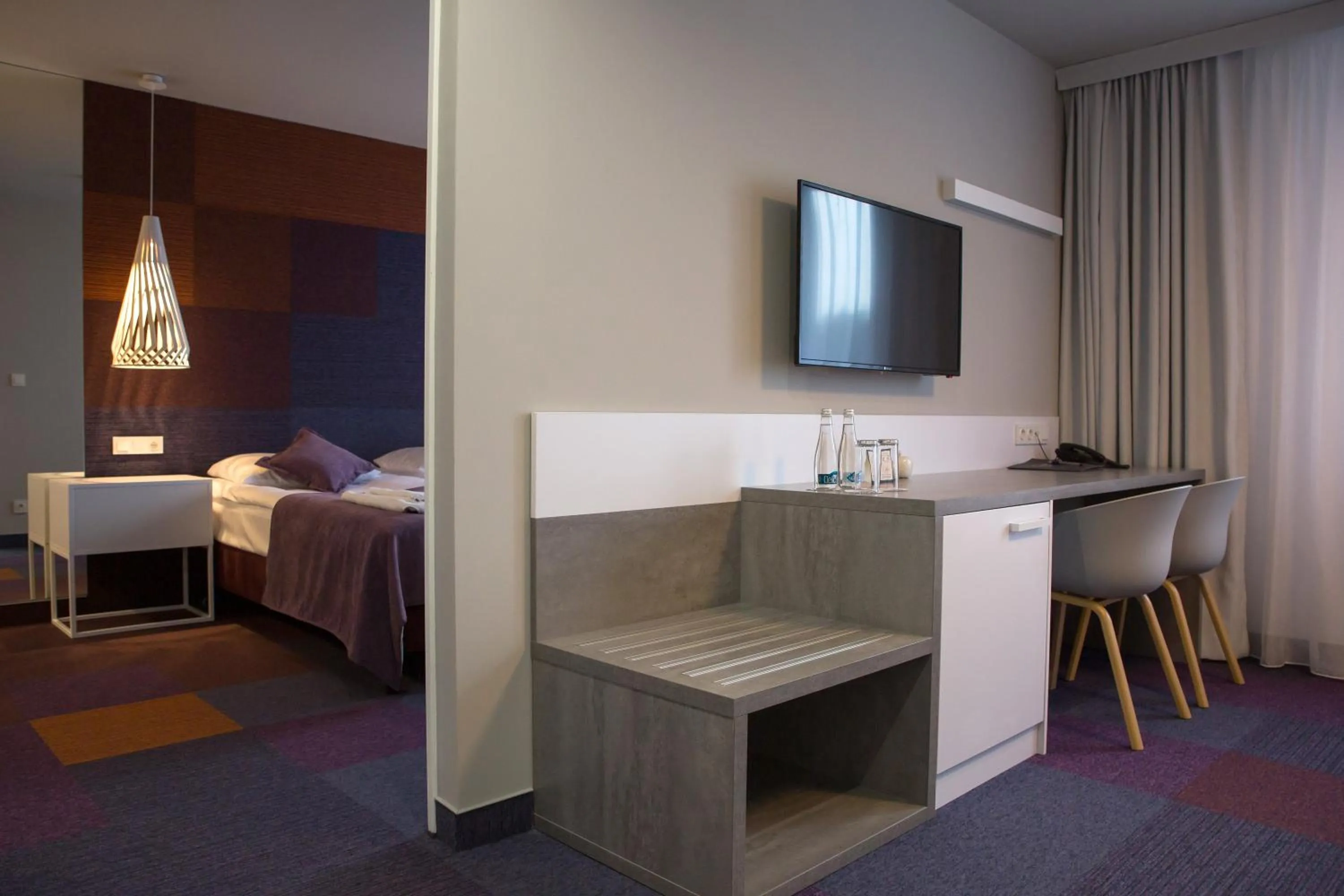 Bed in Hotel Quattro