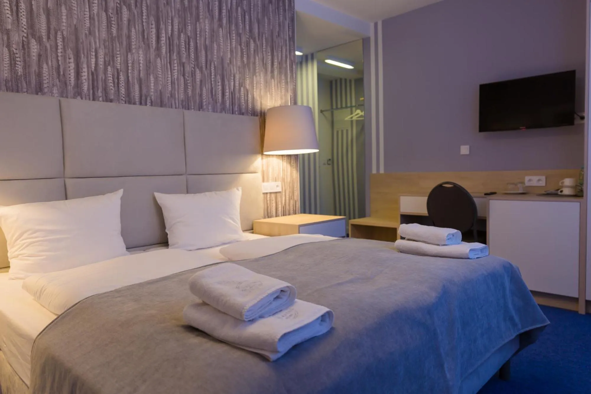 Bed in Hotel Quattro