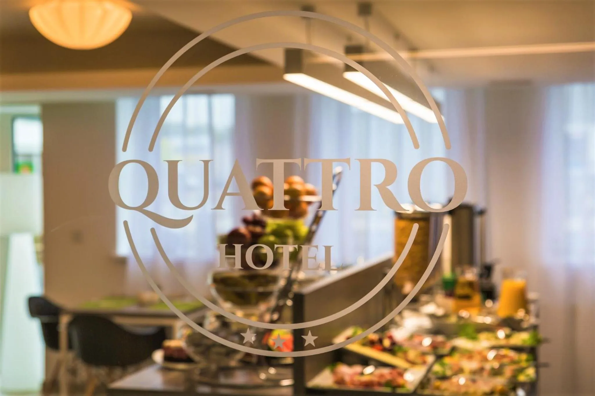Property logo or sign in Hotel Quattro