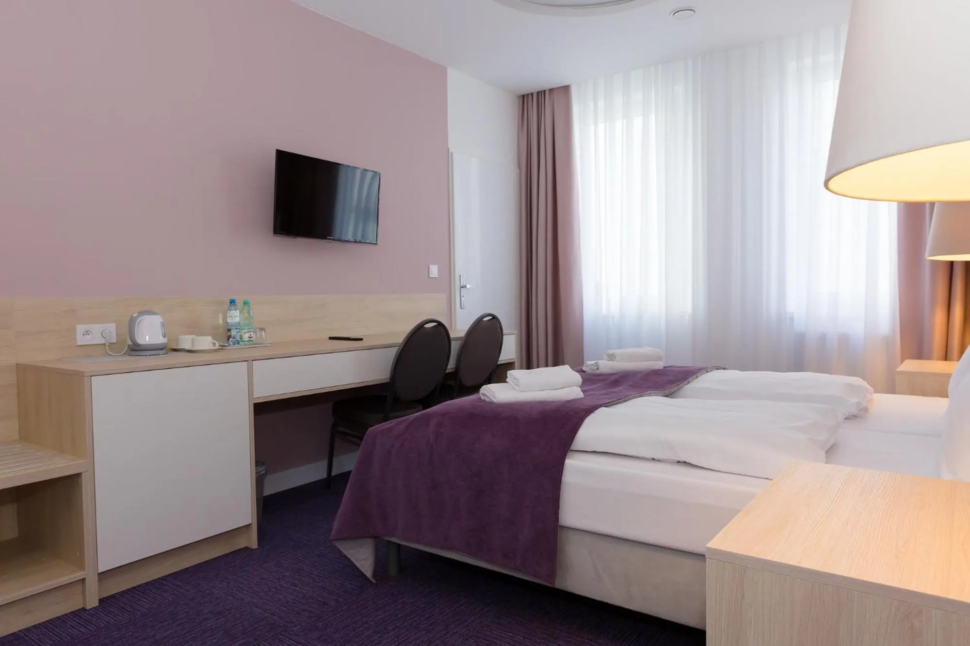 Bed in Hotel Quattro