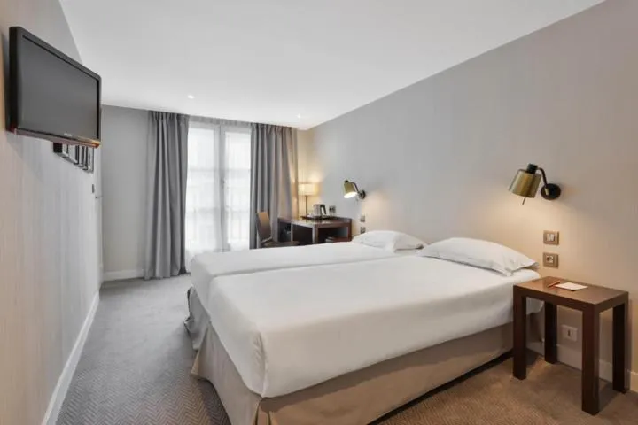 Bed in Hôtel Londres et New York - Teritoria