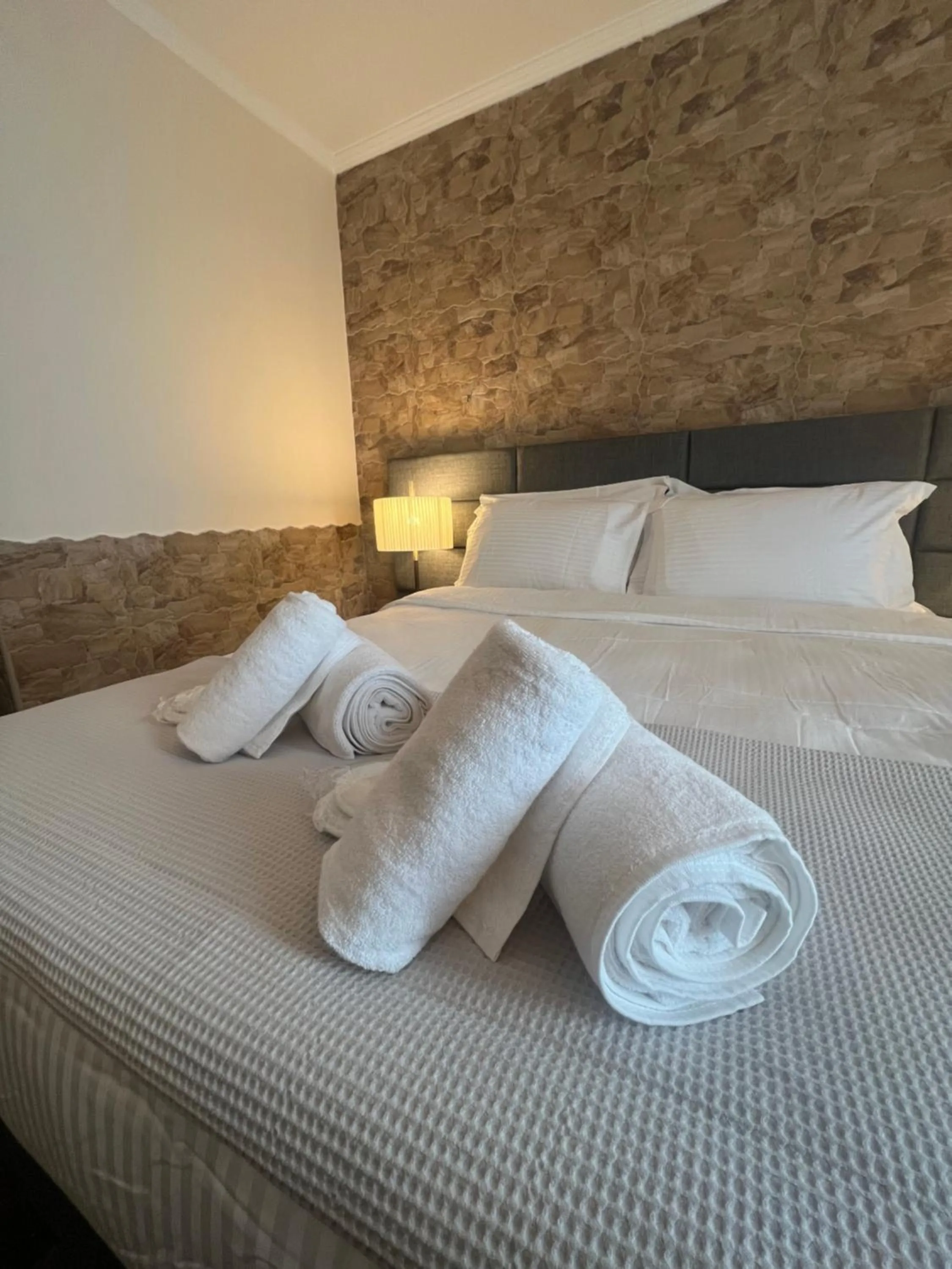 towels, Bed in Lighthouse Hotel