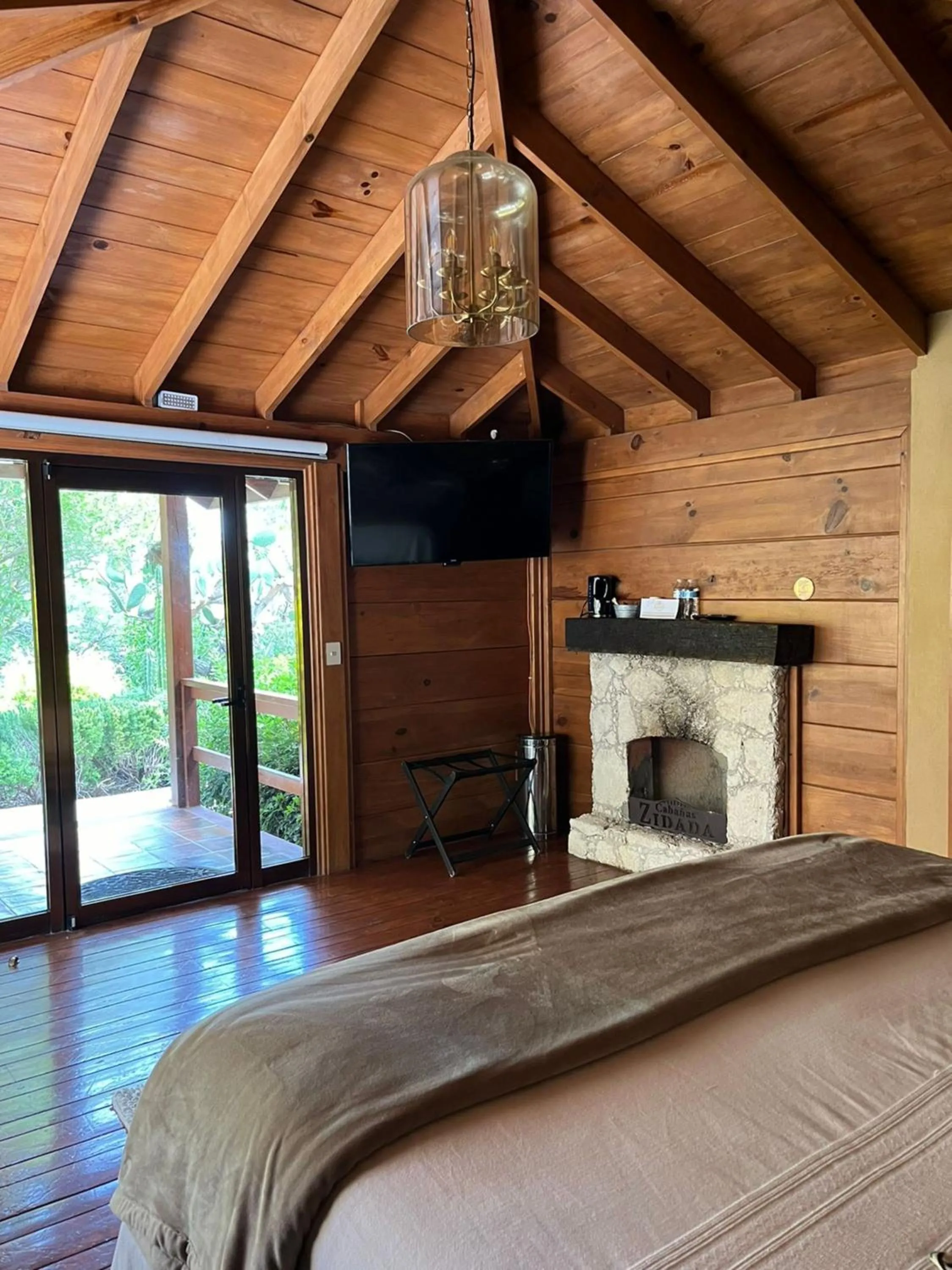 fireplace, Bed in Zidada Hotel and Chalets