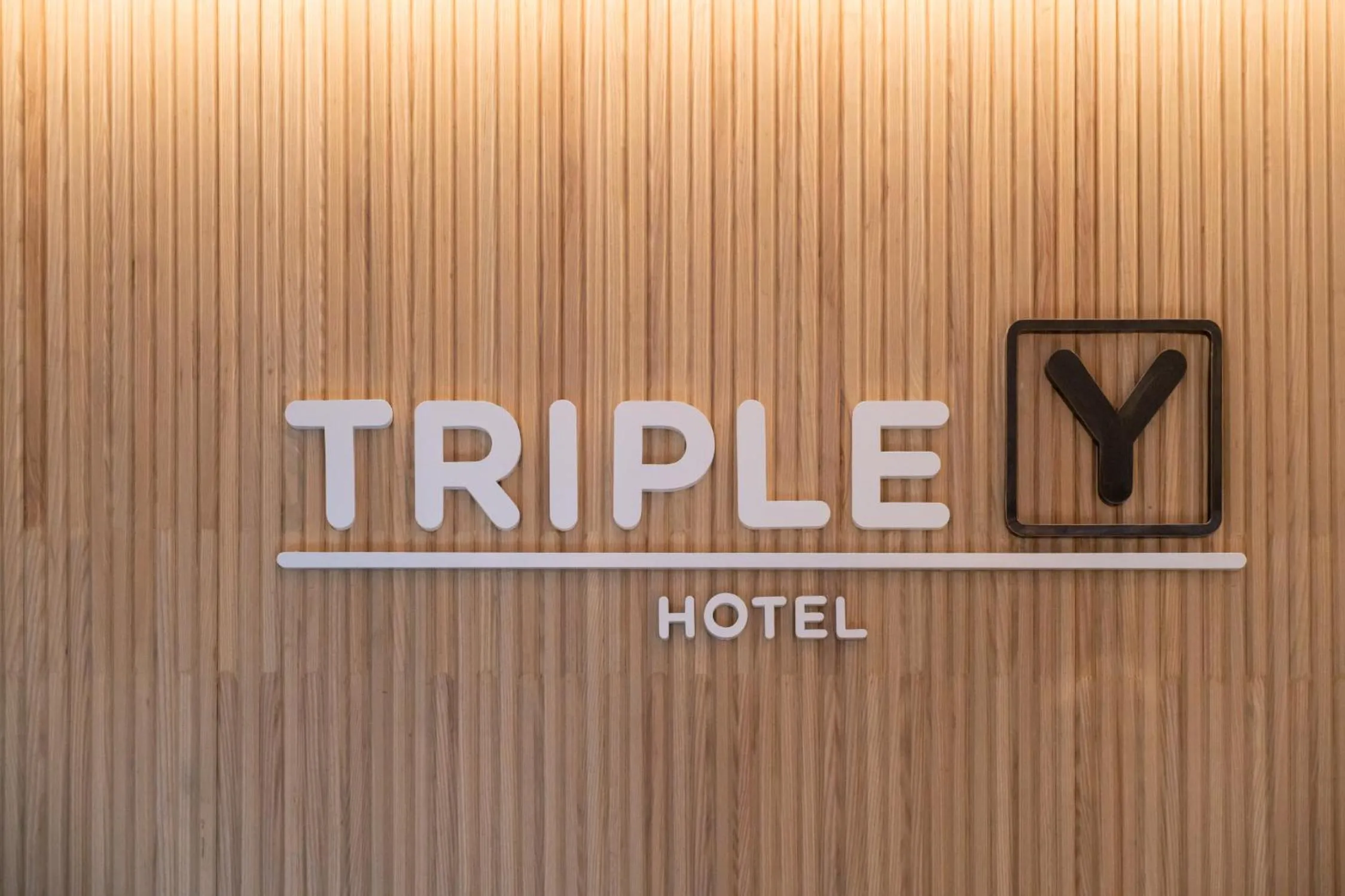 Property logo or sign in Triple Y Hotel