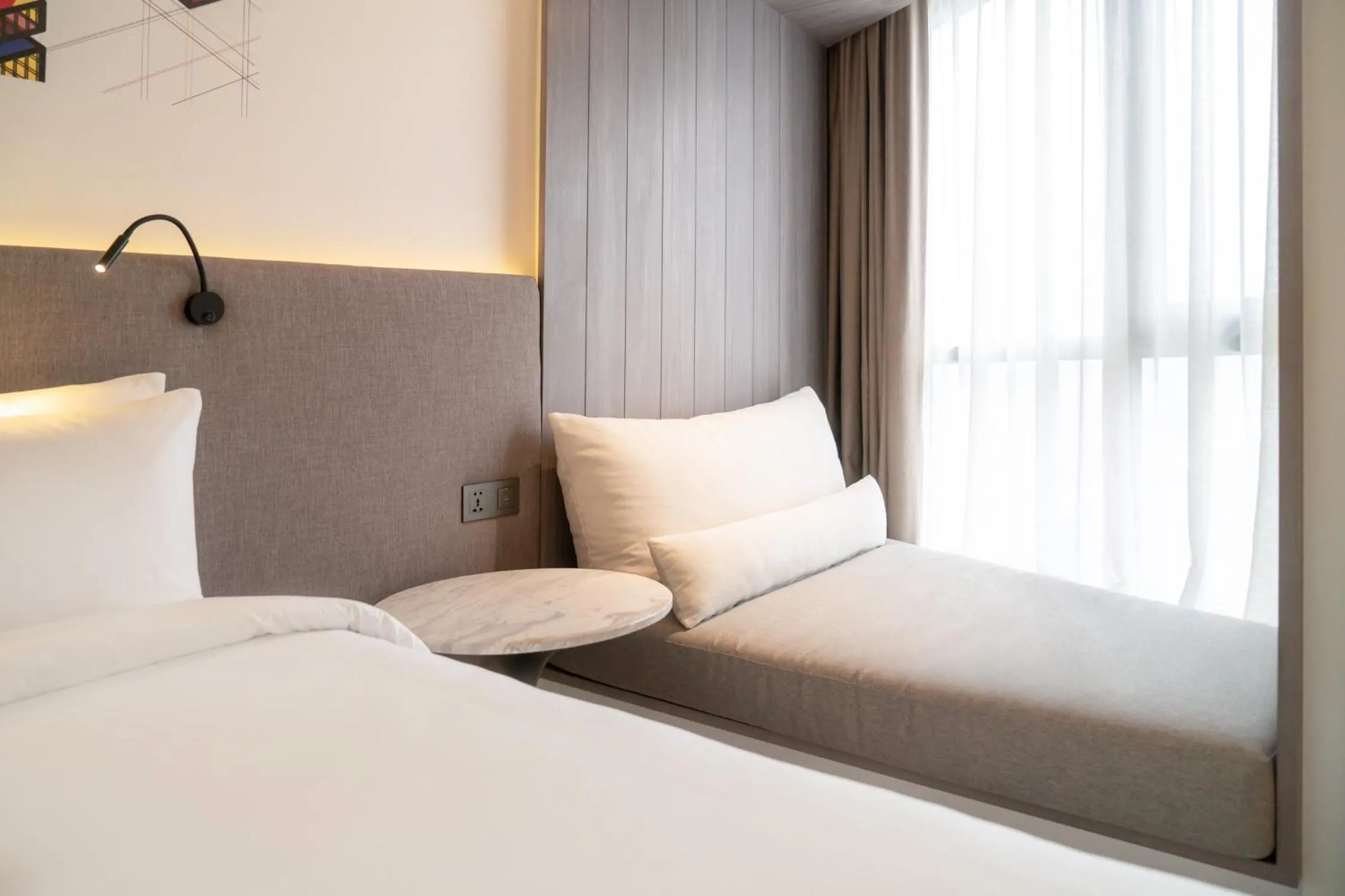 Seating area, Bed in Triple Y Hotel