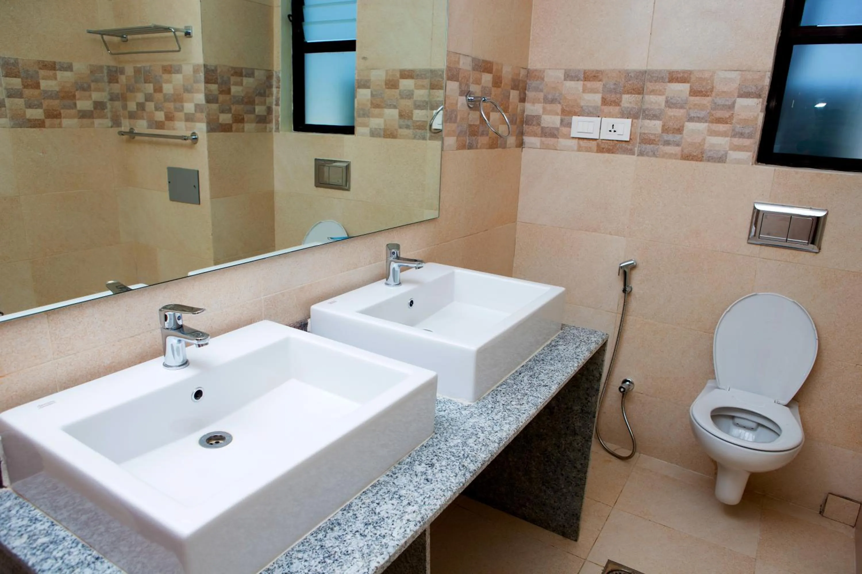 Toilet in Sarovar Residency Serviced Apartment Hotel