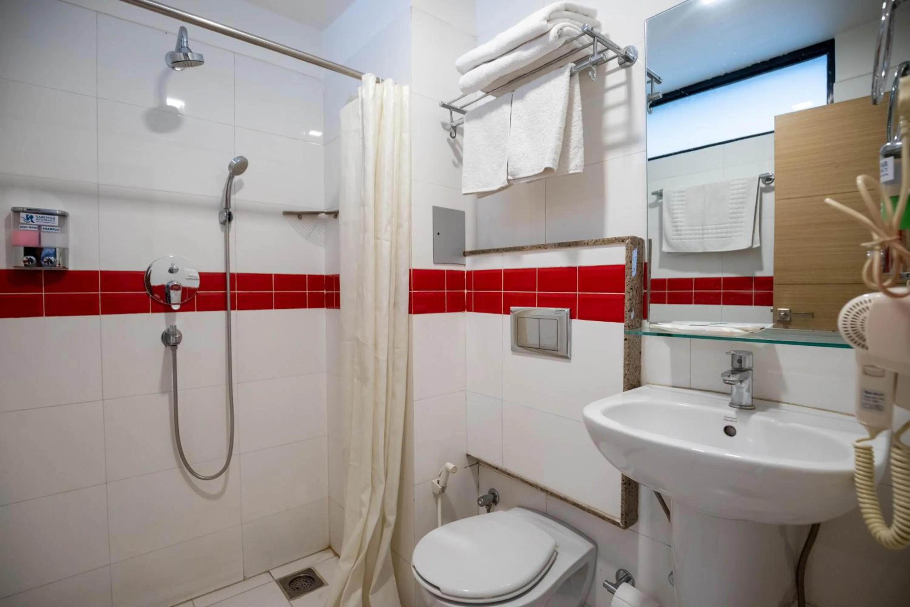 Toilet in Sarovar Residency Serviced Apartment Hotel