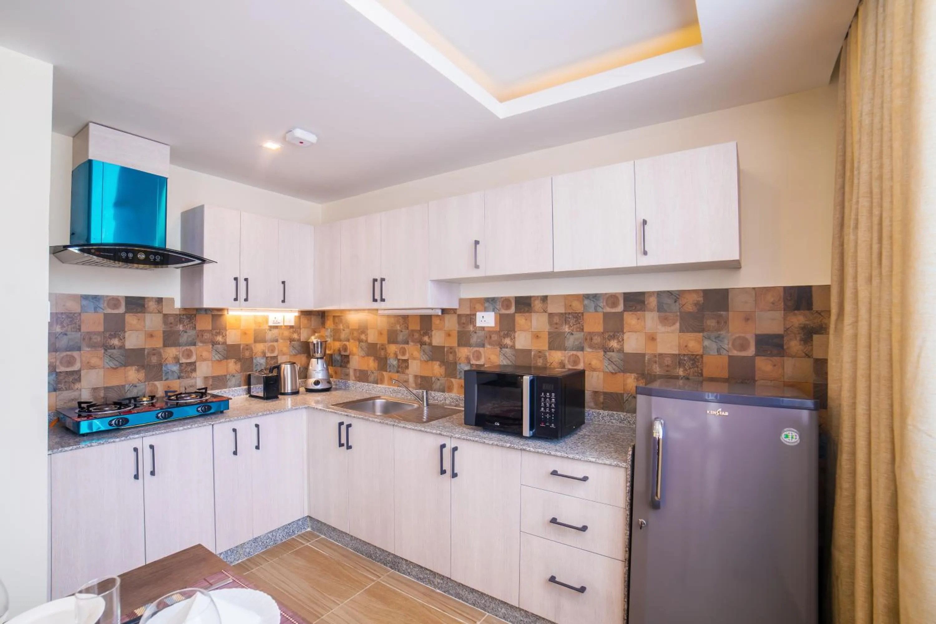 Kitchen or kitchenette in Sarovar Residency Serviced Apartment Hotel