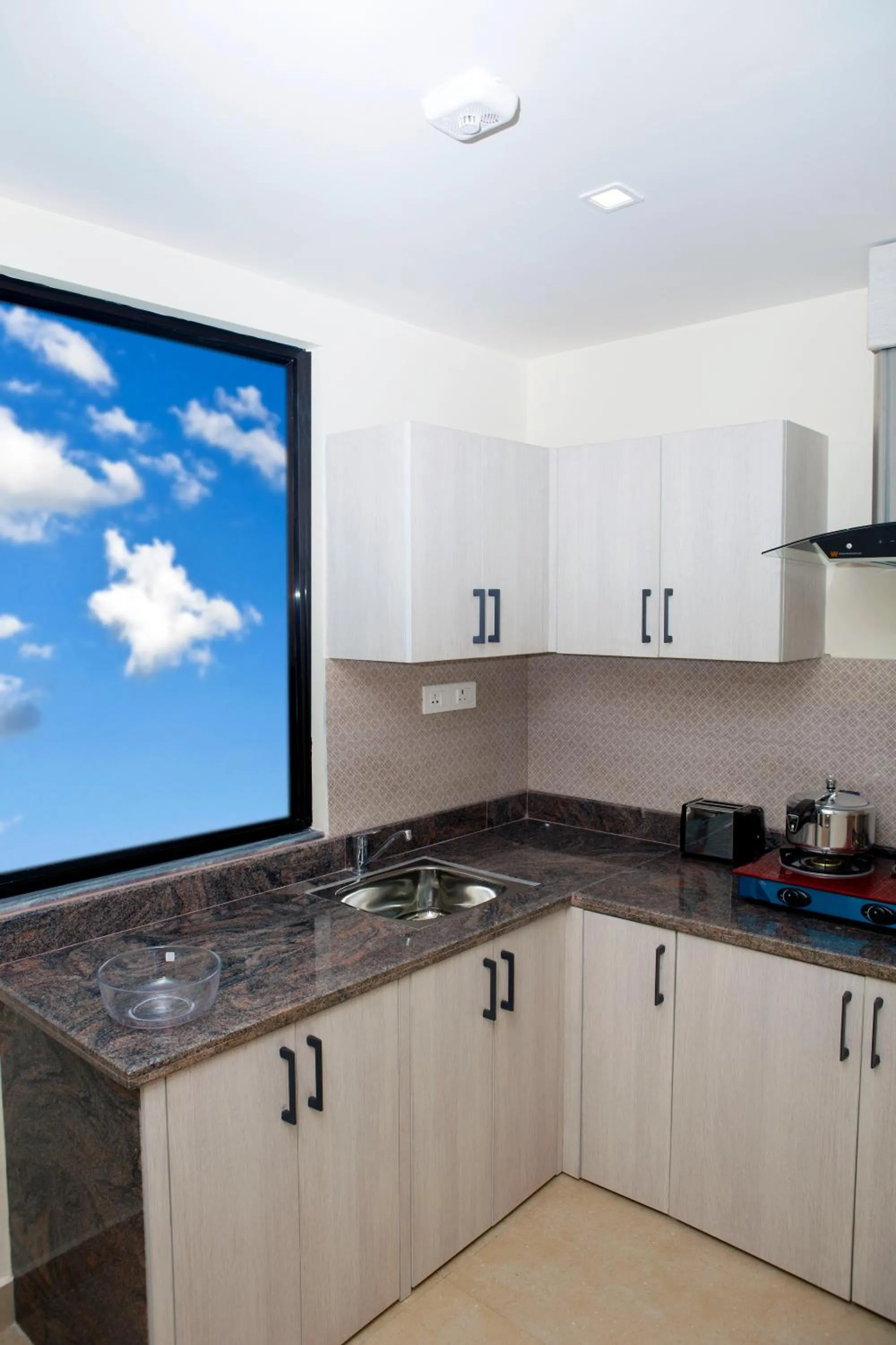 Kitchen or kitchenette in Sarovar Residency Serviced Apartment Hotel