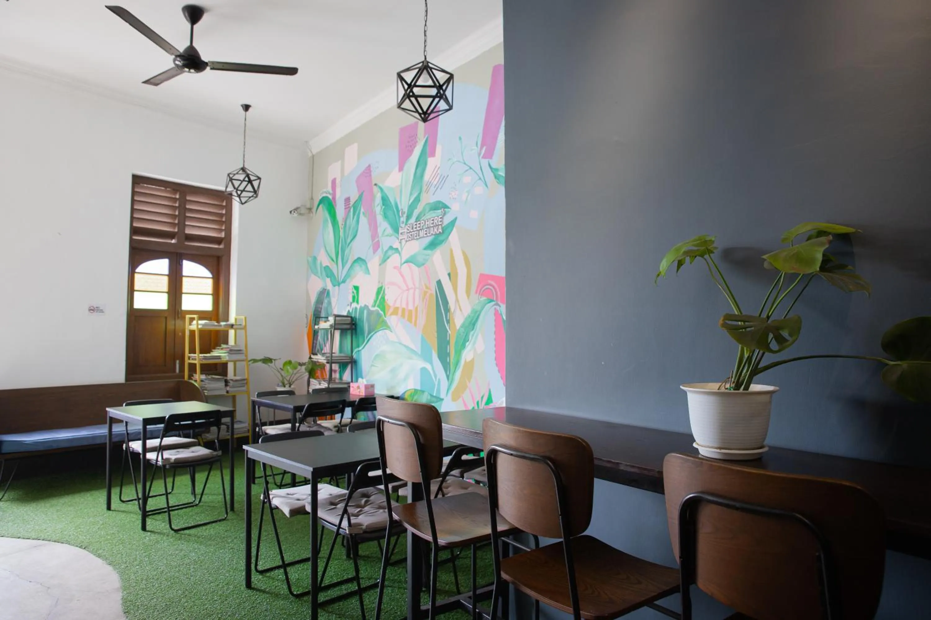 Communal lounge/ TV room in Sleep Here Hostel, Melaka