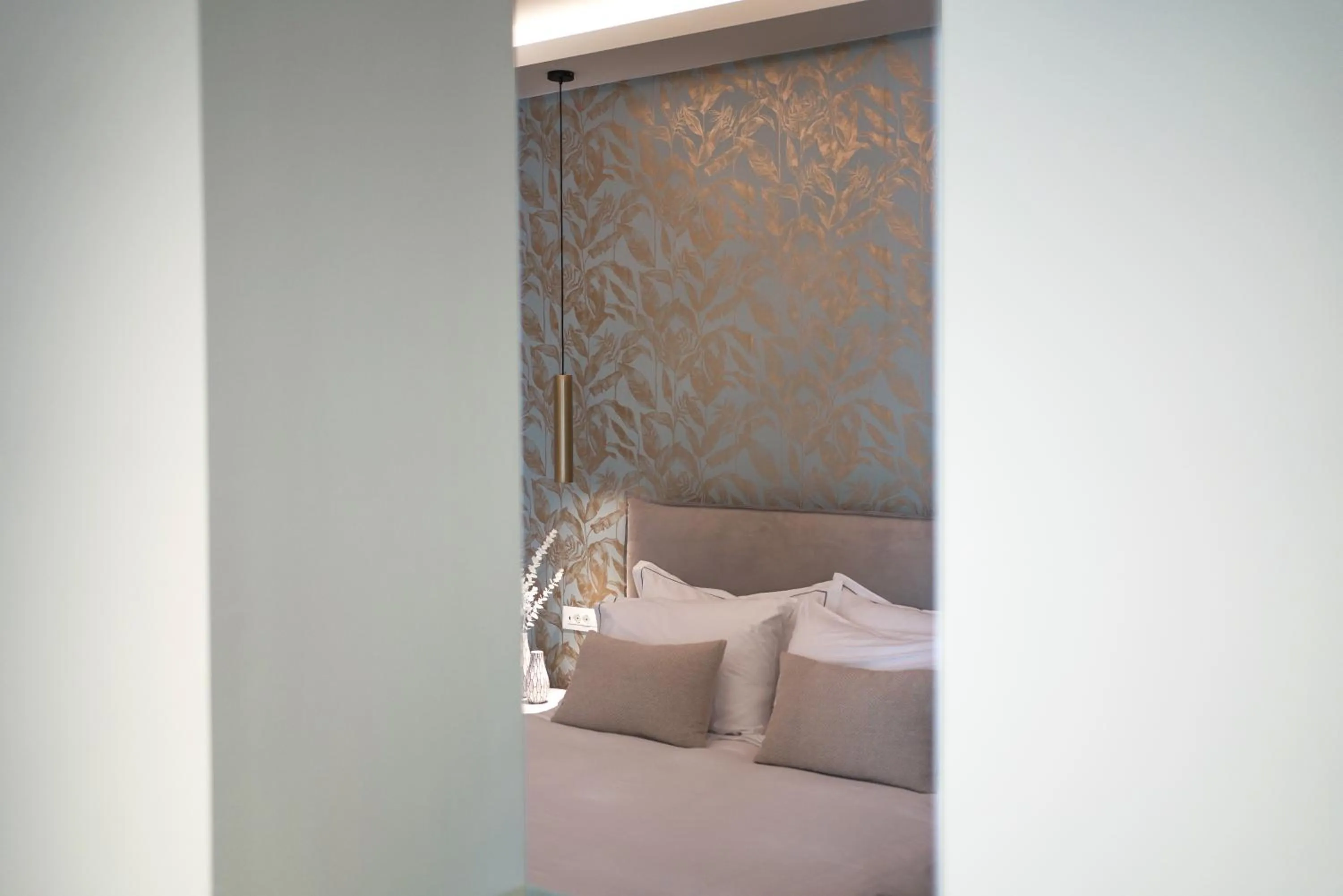 Bed in Pafsilipon Suites